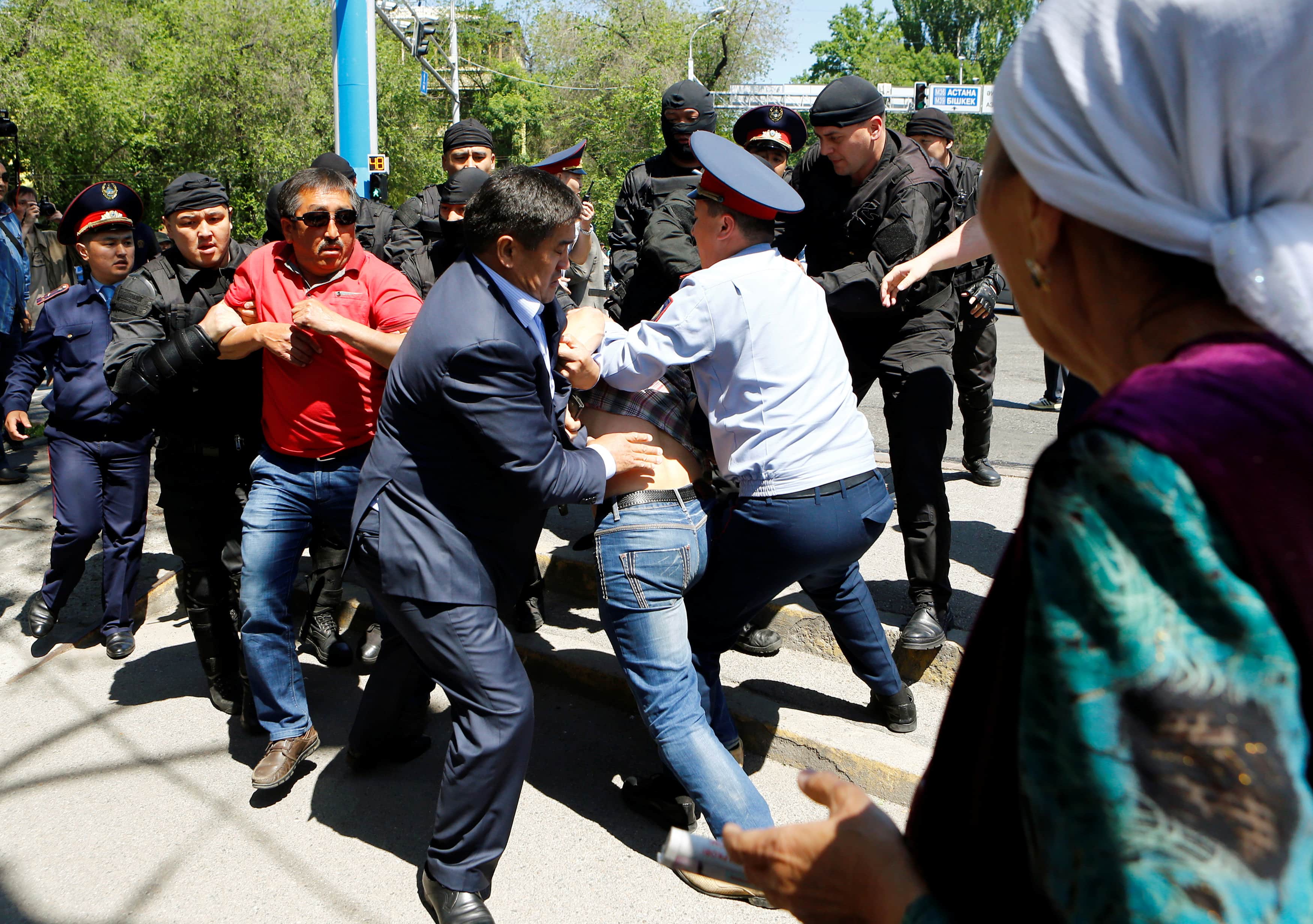 Riot police officers detain demonstrators during a protest against President Nursultan Nazarbayev's government and the land reform it has proposed, in Almaty, Kazakhstan, 21 May 2016, REUTERS/Shamil Zhumatov