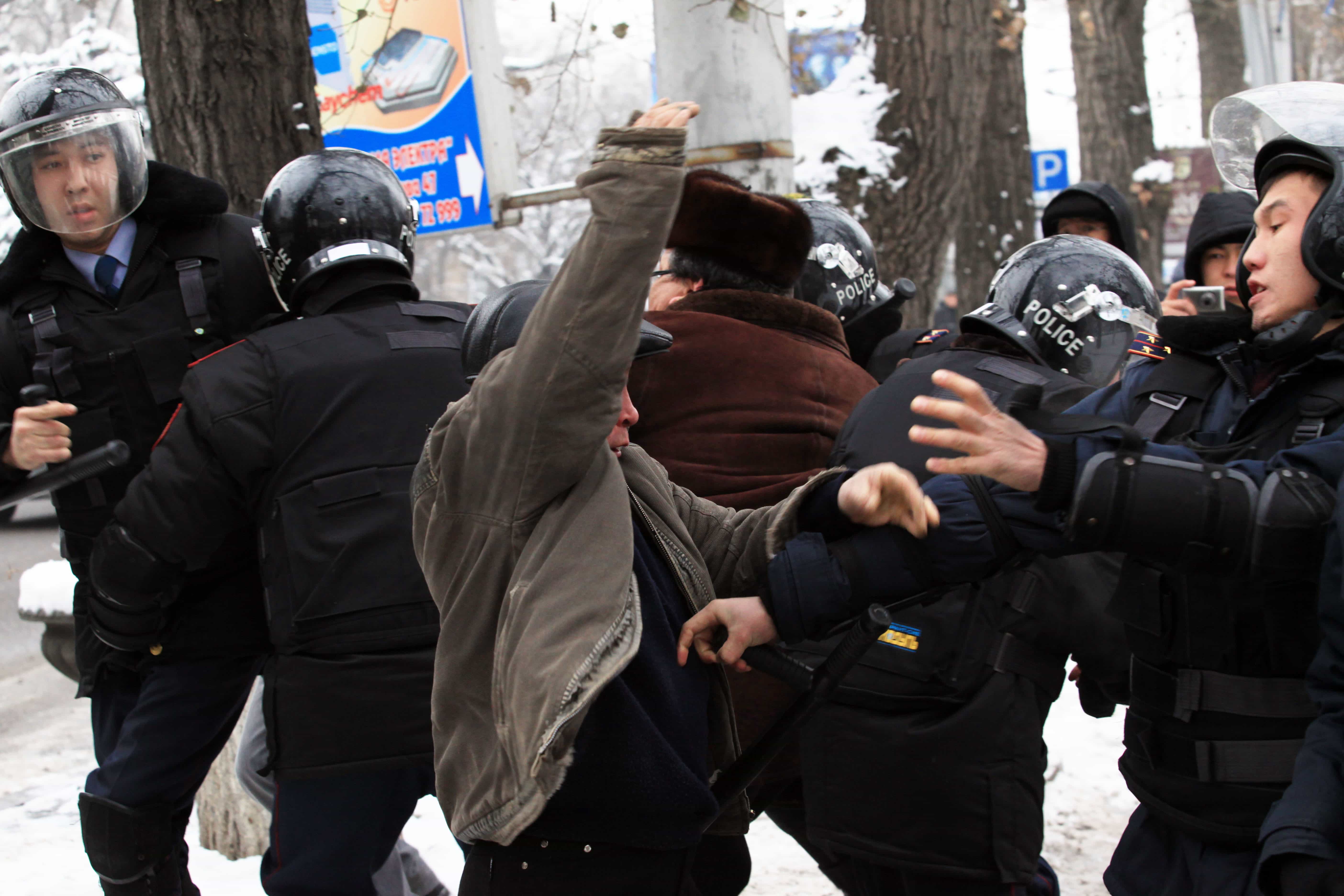 Kazakh riot police officers detain demonstrators during an opposition rally in Almaty, 17 December 2011., AP Photo