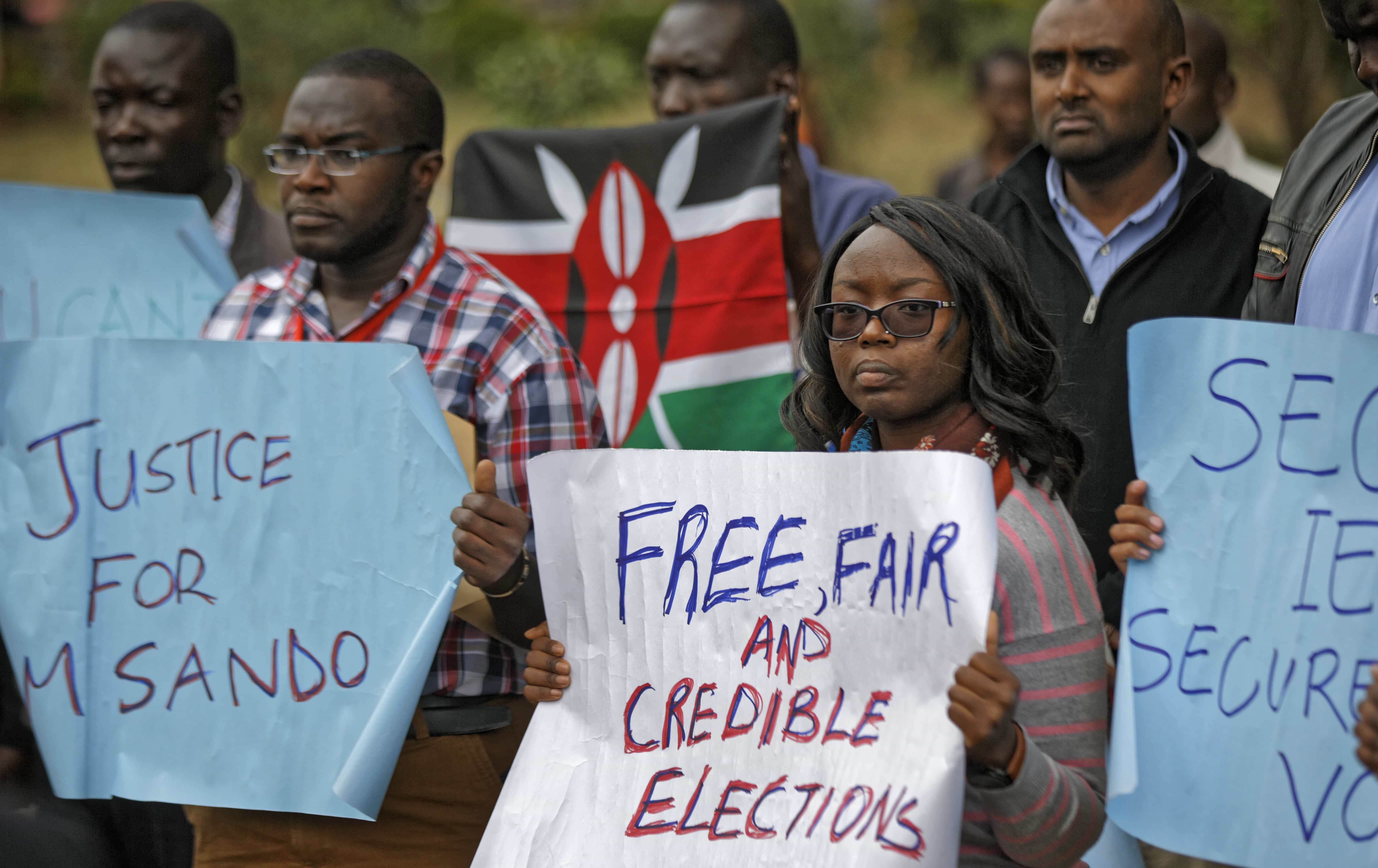 Members of civil society groups protest the killing of electoral commission information technology manager Christopher Msando, at a demonstration in downtown Nairobi, 1 August 2017, AP Photo/Ben Curtis