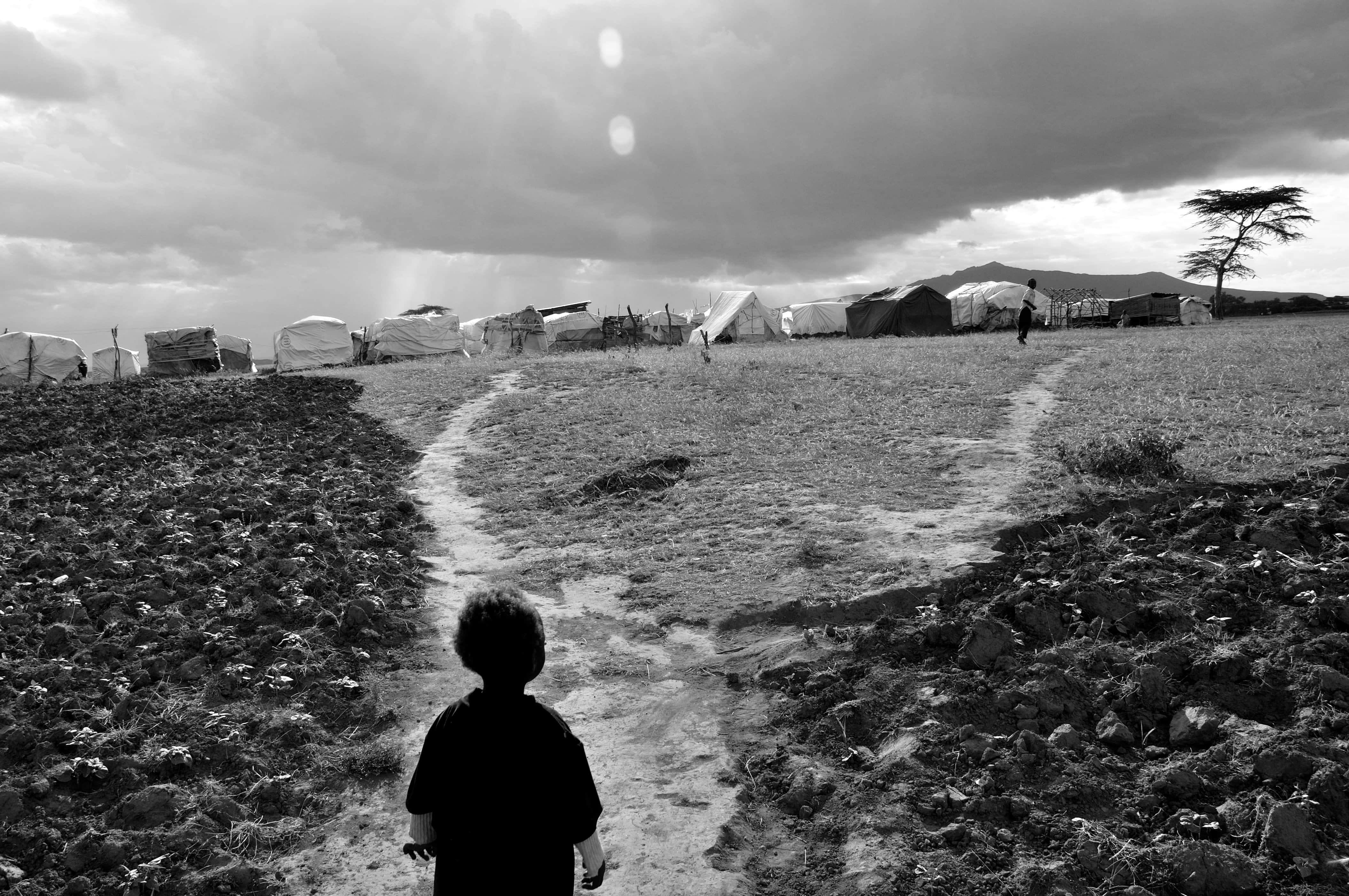 A child walks back to an IDP camp in the Rift Valley, Kenya, 8 August 2010., Demotix/Tobin Jones