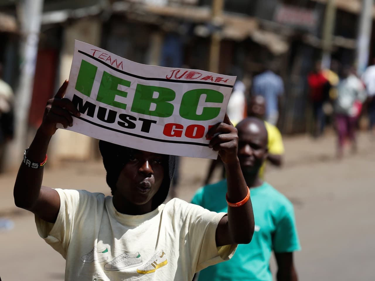 A supporter of CORD carries a placard during a protest against the IEBC in Nairobi, 6 June 2016, REUTERS/Thomas Mukoya