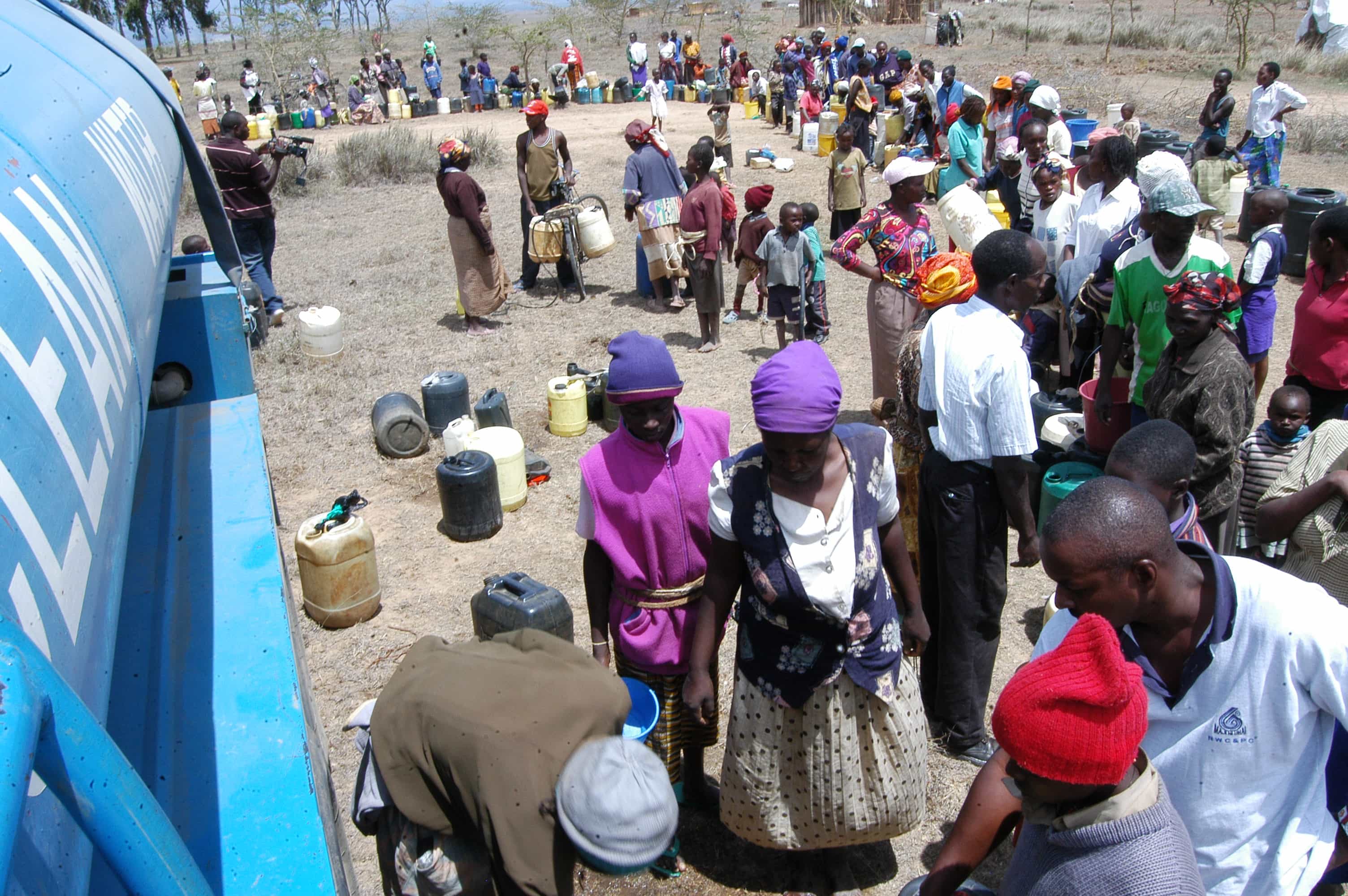 People queue to fill up their containers at a water station in Nairobi., JOE MWANGI/Demotix
