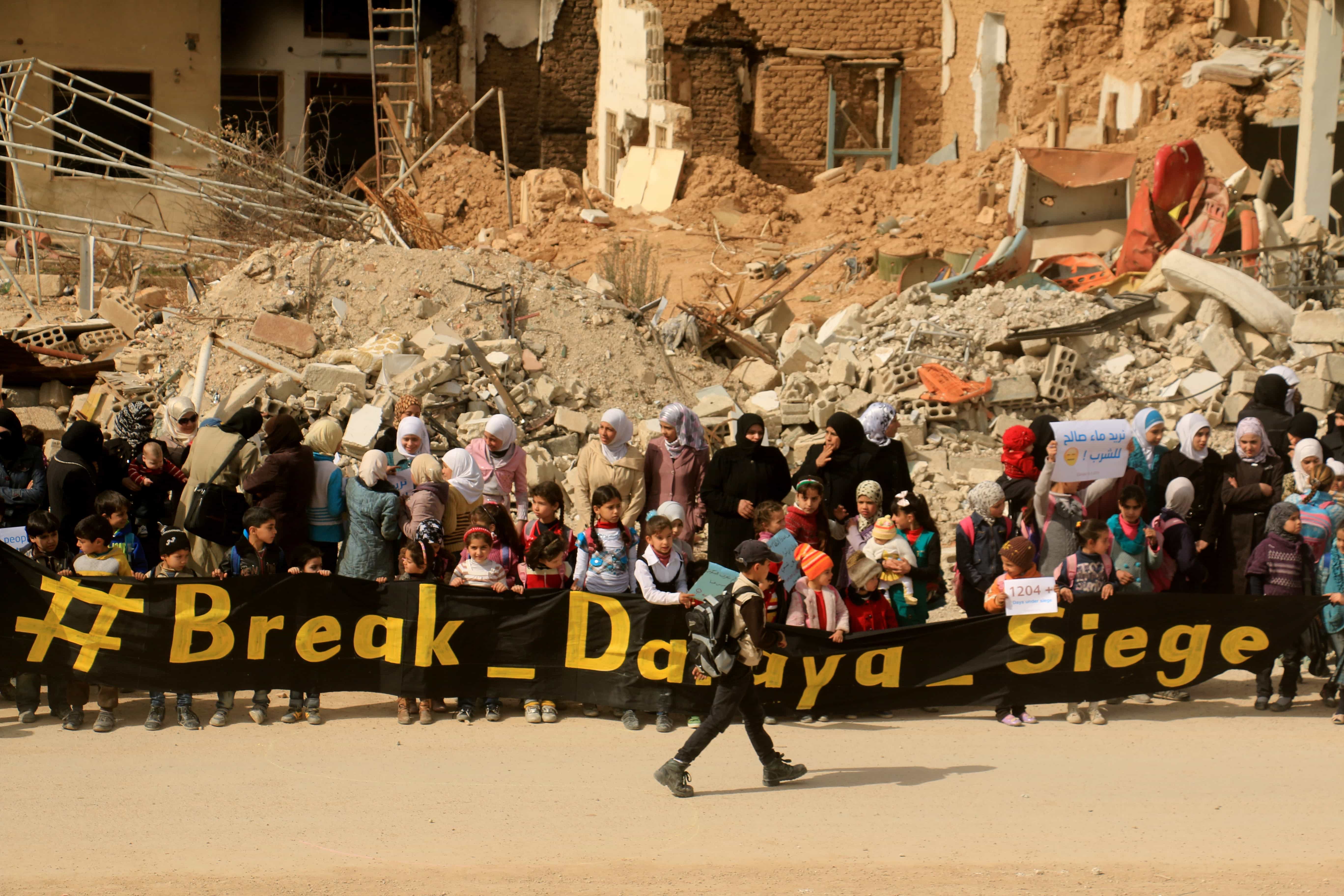 Women and children stage a protest against Assad Regime's siege to the town of Darayya, Damascus, Syria, 9 March 2016, Hussam El Ahmed /Anadolu Agency/Getty Images