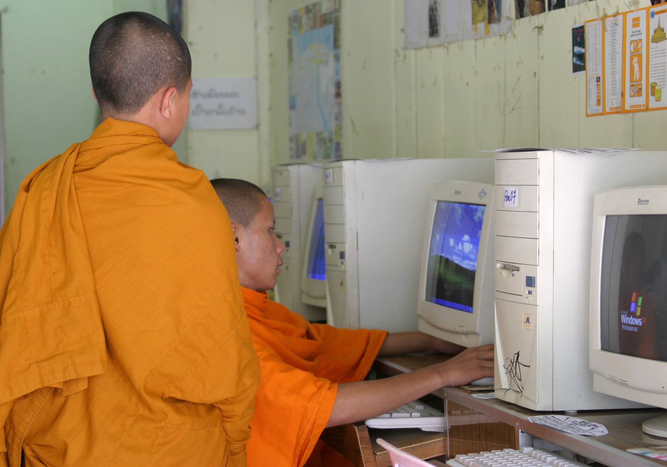 Buddhist monks at an Internet cafe in Luang Prabang, Laos, 3 December 2004, REUTERS/John Ruwitch RKR/CN