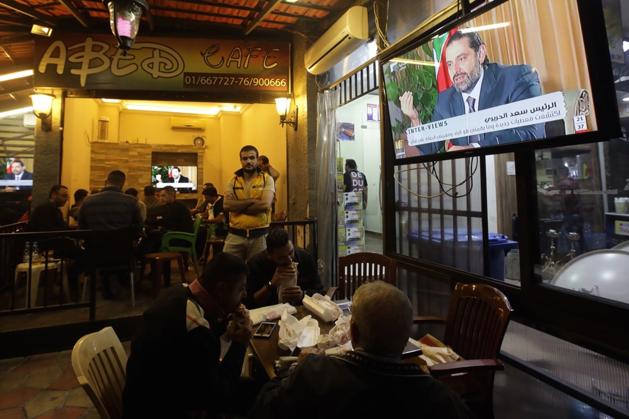 People watch an interview with Lebanon's resigned prime minister Saad Hariri at a coffee shop in Beirut, Lebanon, 12 November 2017, ANWAR AMRO/AFP/Getty Images