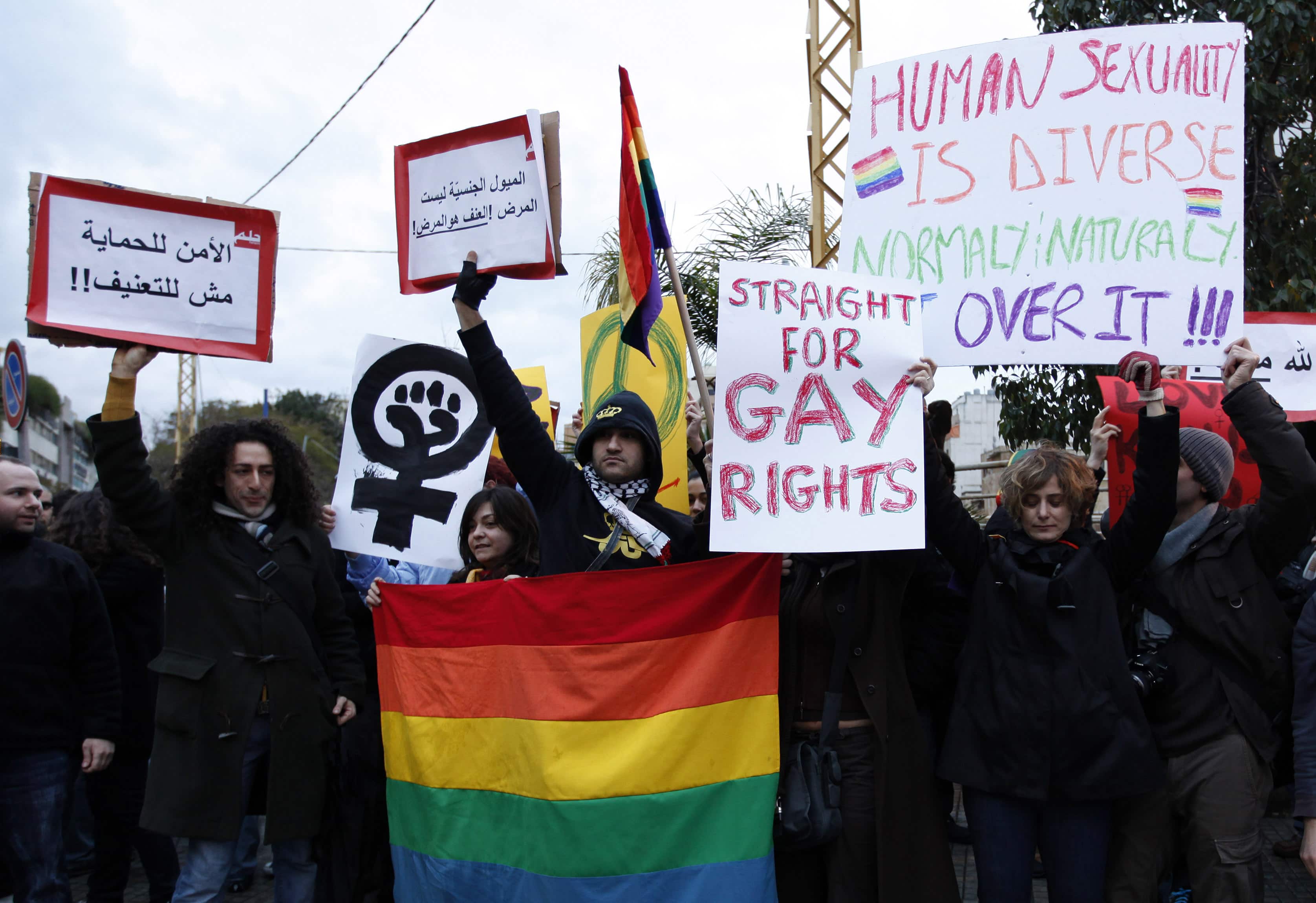 In this Sunday, 22 February 2009 picture, protesters carry banners during a sit-in for gays and lesbians in Beirut, AP Photo/Hussein Malla