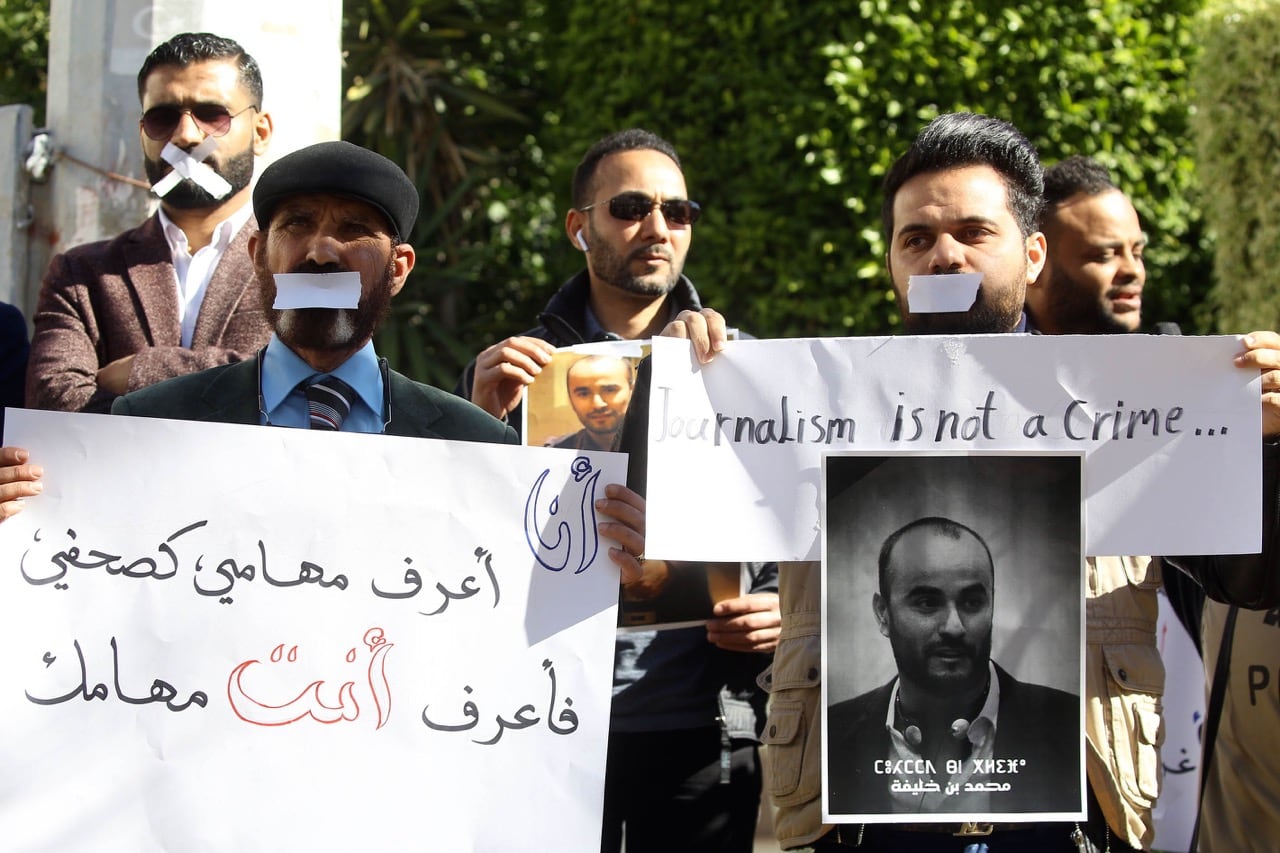 Libyan journalists hold a portrait of fellow reporter Mohammed bin Khalifa, who was killed the previous day while covering militia clashes, during a protest to denounce violence against journalists, in Tripoli, 20 January 2019, MAHMUD TURKIA/AFP/Getty Images