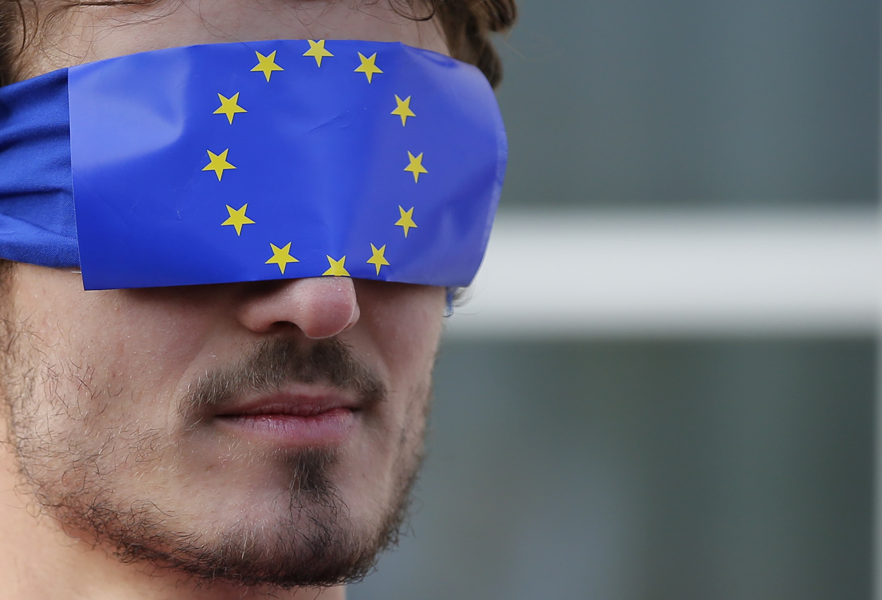 Protestors demonstrate in support of whistleblower, asking for more transparency, in front of the court before the start of the LuxLeaks trial in Luxembourg, 26 April 2016, REUTERS/Vincent Kessler