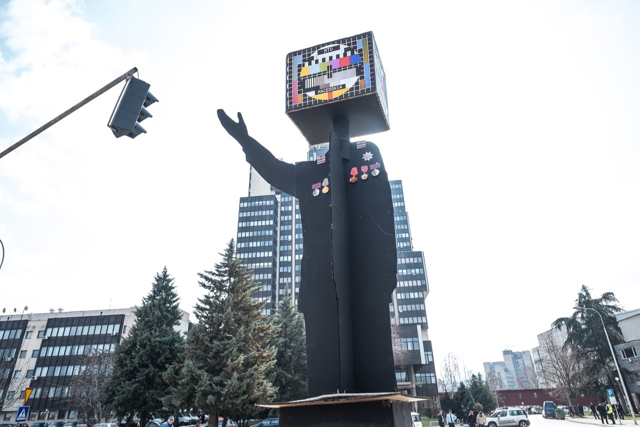 A prop symbolizes the PBS as a propaganda tool during a protest in front of the PBS building, 28 February 2015, Vanco Dzambaski/Flickr