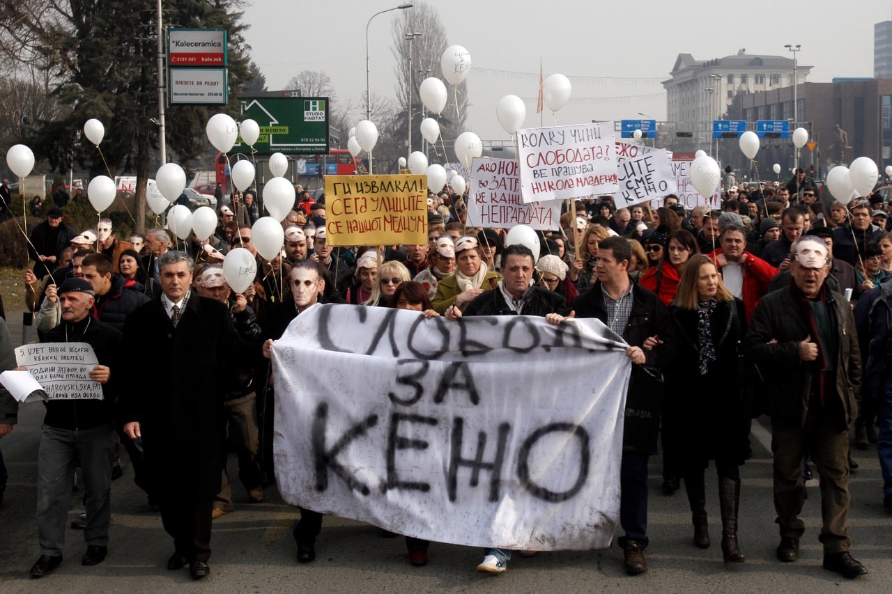 Macedonian journalist Tomislav Kezarovski, center, marches with his colleagues and friends during a protest in Skopje, Macedonia, 20 January 2015. The banner at the front reads "Freedom for Kezo" (Kezarovski), AP Photo/Boris Grdanoski