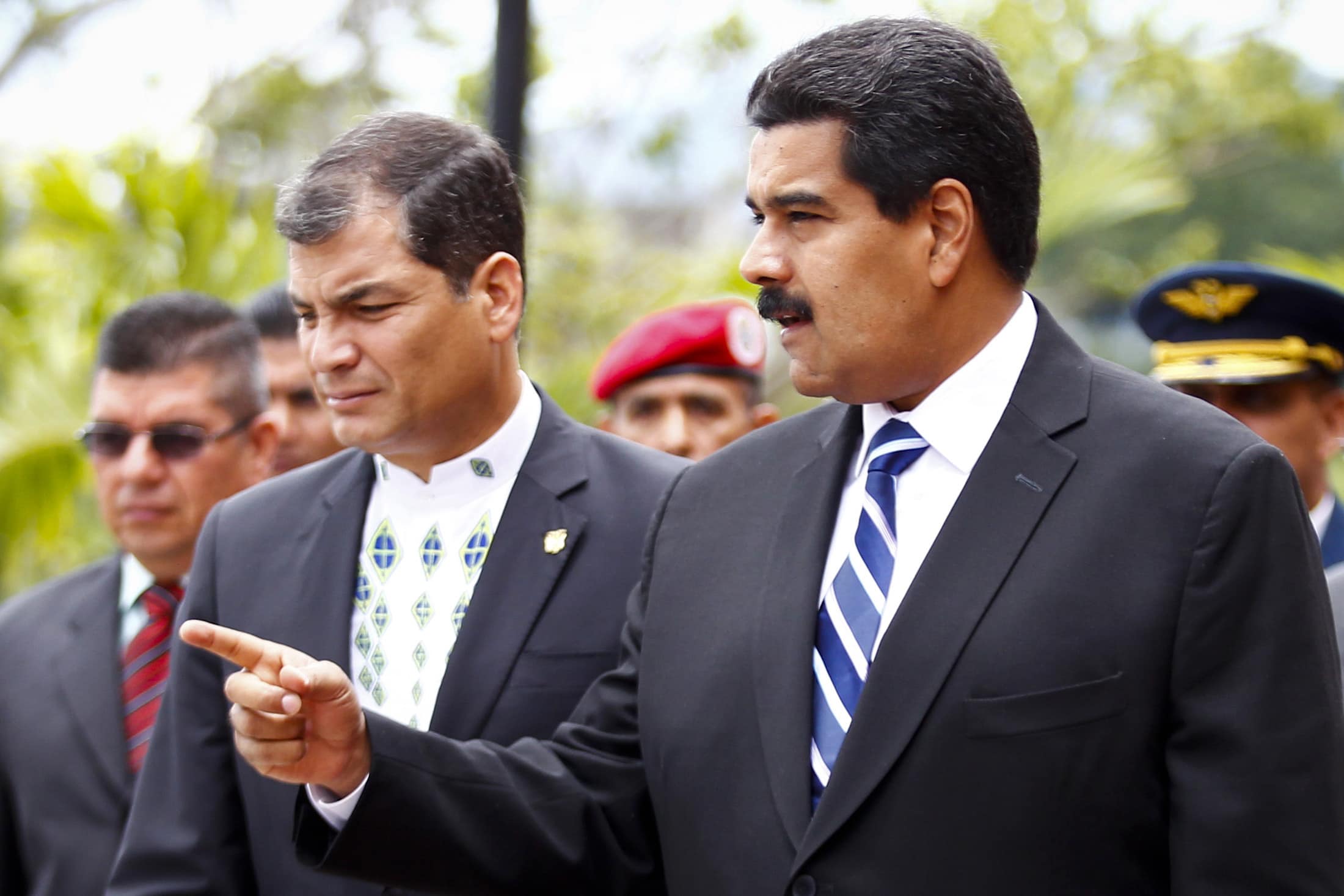 Venezuela's President Nicolas Maduro (R) and Ecuador's President Rafael Correa talk , REUTERS/Carlos Garcia Rawlins