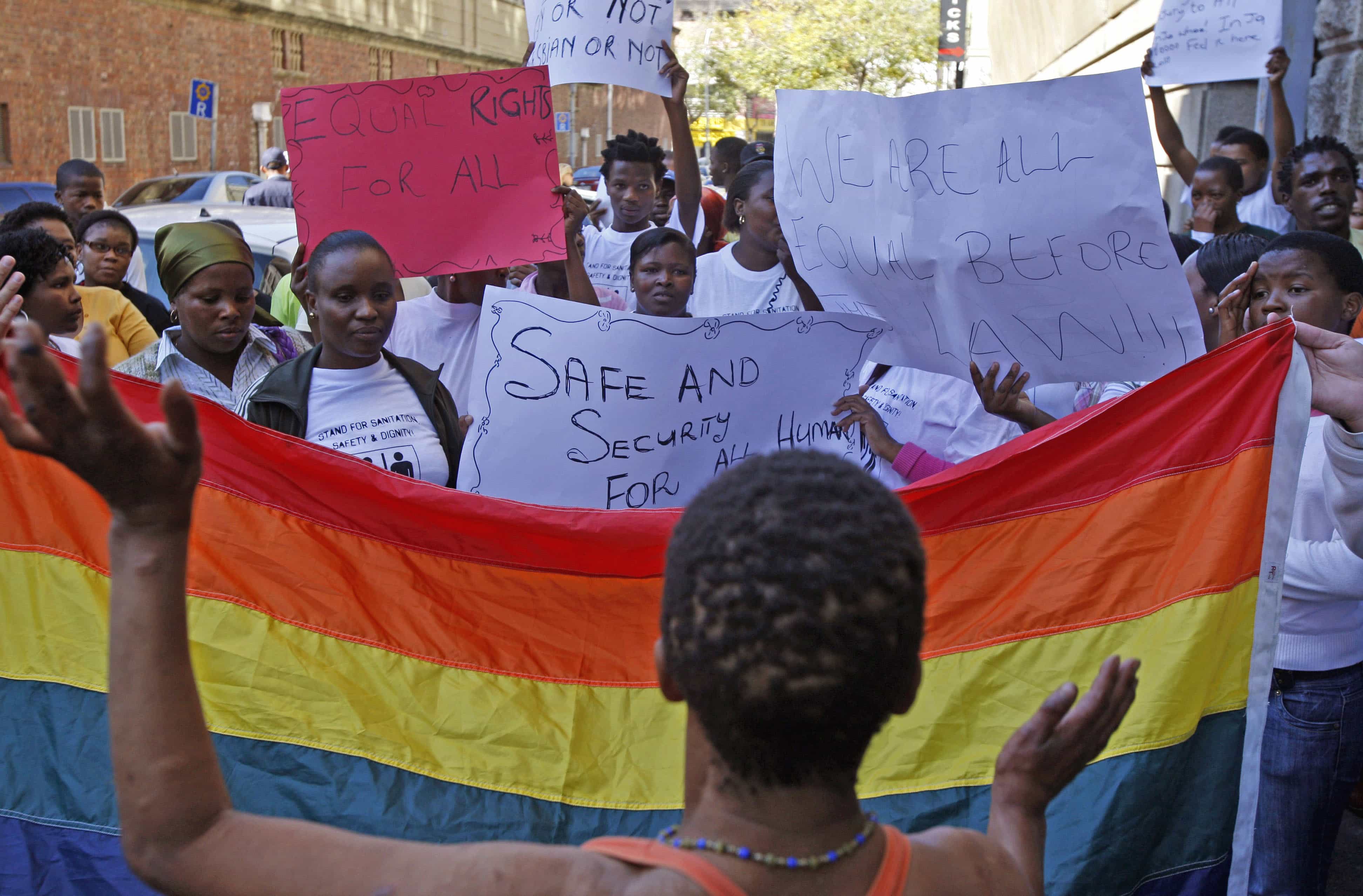 In this May 20, 2010 file photo, women protest against a sentence of 14 years in prison, with hard labor, given to two men in Malawi under Malawi's anti-gay legislation, in Cape Town, South Africa, 20 May 2010, AP Photo/Schalk van Zuydam, File