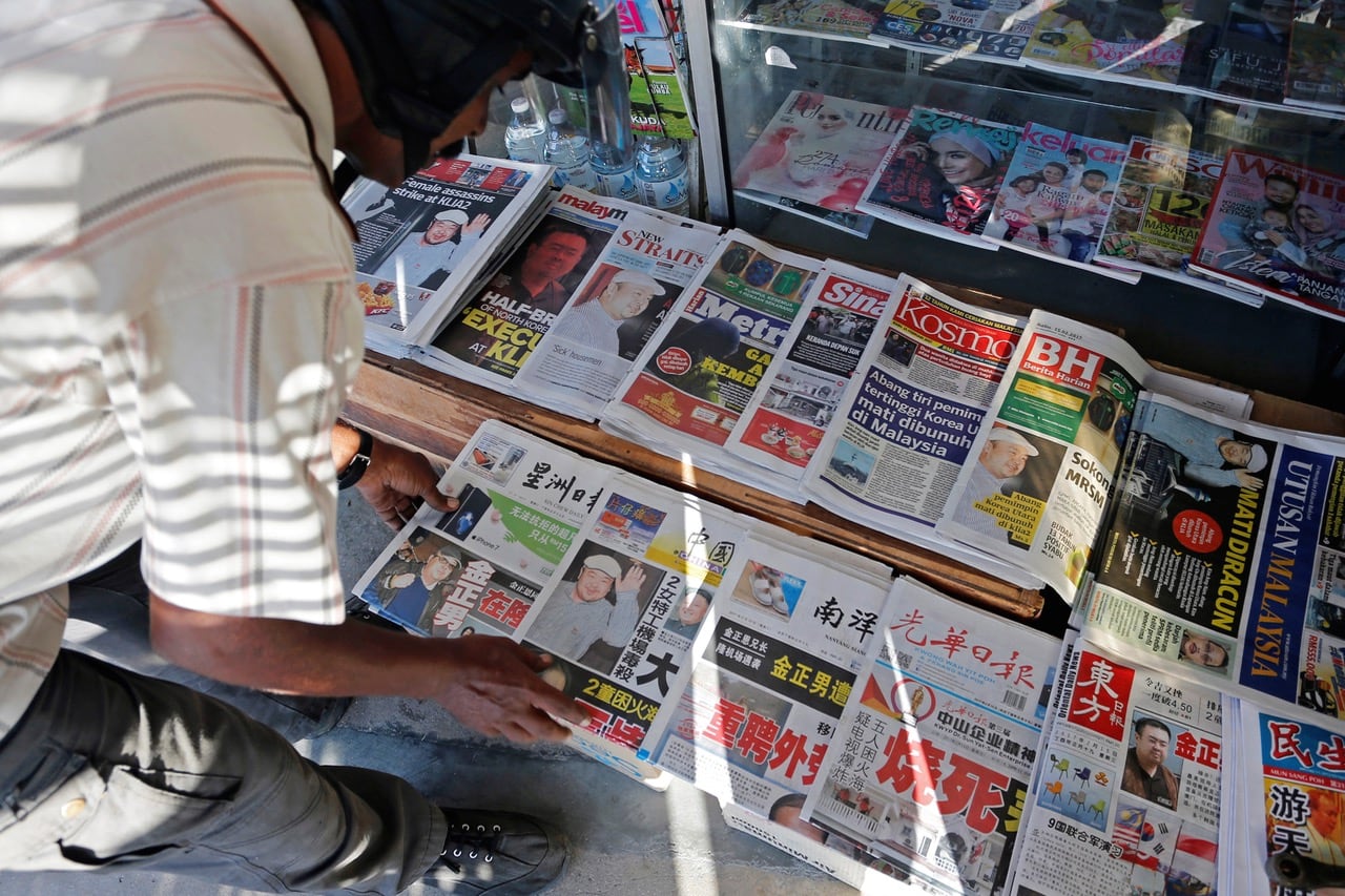 A vendor arranges newspapers at a newsstand outside Kuala Lumpur, Malaysia, 15 February 2017 , REUTERS/Lai Seng Sin