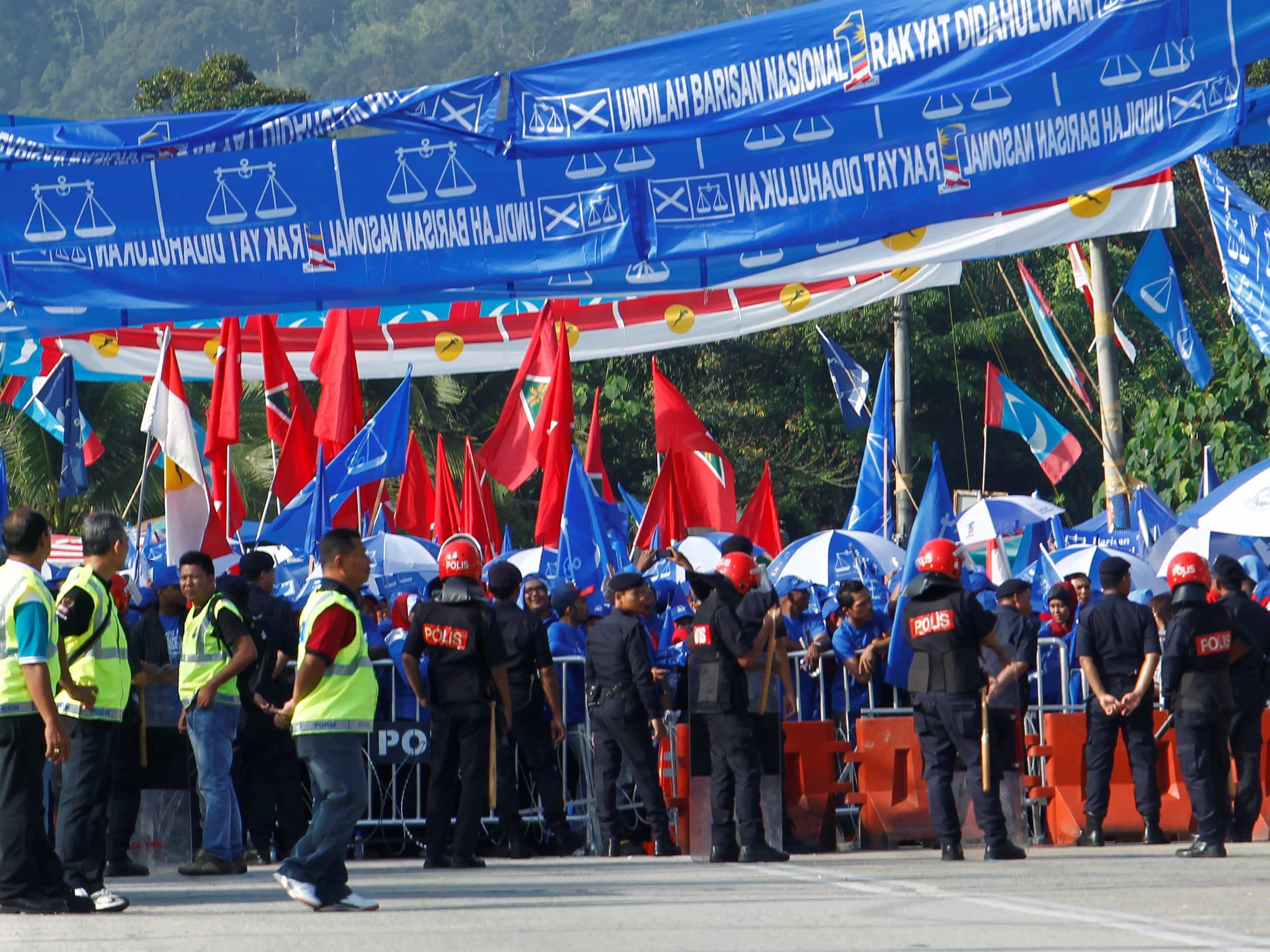 On 20 April 2013, people gather in Permatang Pauh to show support for political party candidates arriving to file their nomination papers for the upcoming general elections, REUTERS/Samsul Said