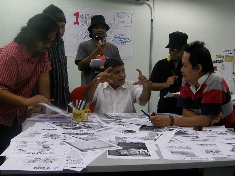 Malaysian political cartoonist Zunar working on "Perak Darul Kartun", a cartoon book which was banned by the government in 2010, radiantjustice/Flickr