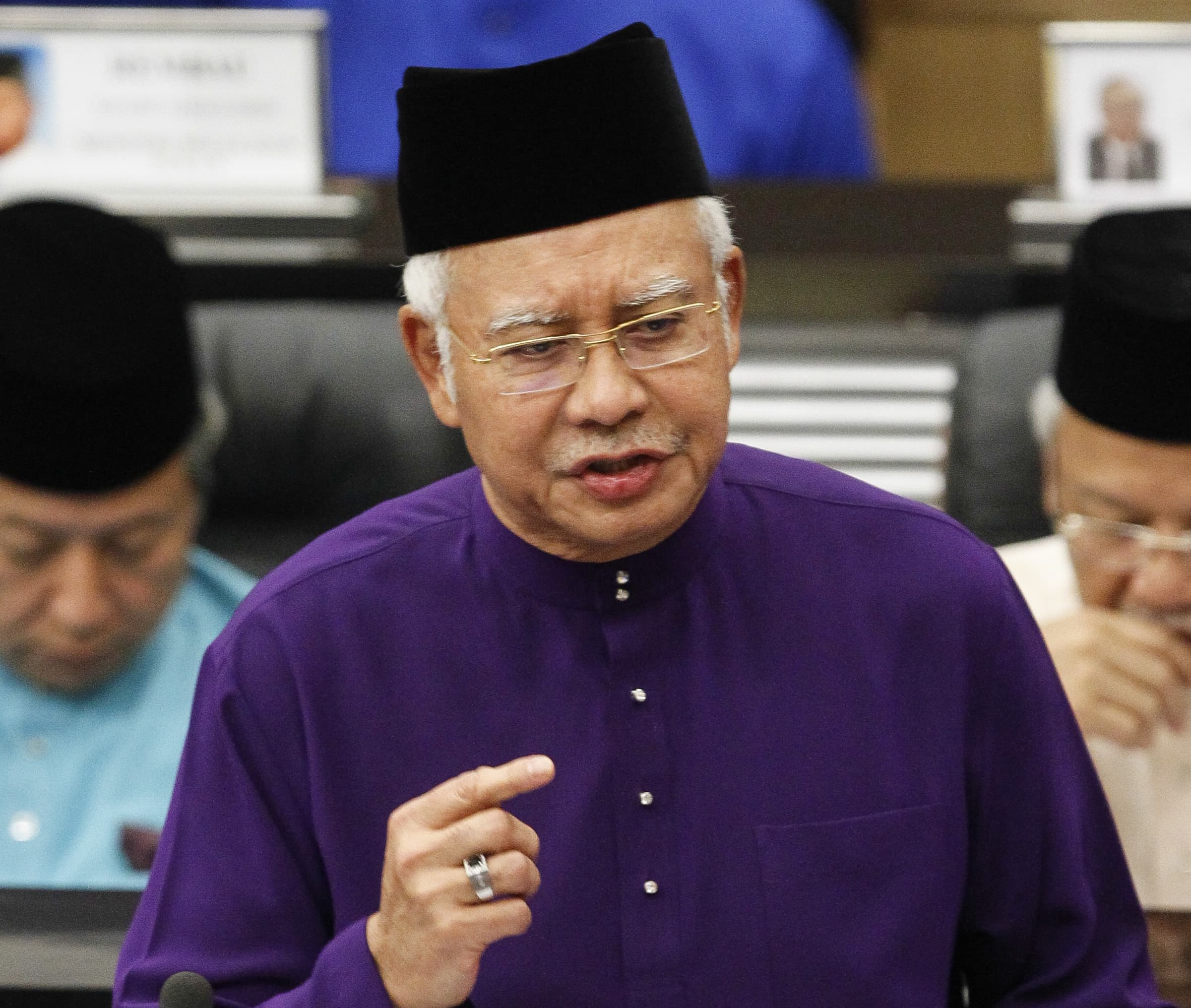 Malaysian Prime Minister and Finance Minister Najib Razak speaks as he unveils Malaysia's 2016 budget at Parliament House in Kuala Lumpur, Malaysia., Joshua Paul/AP