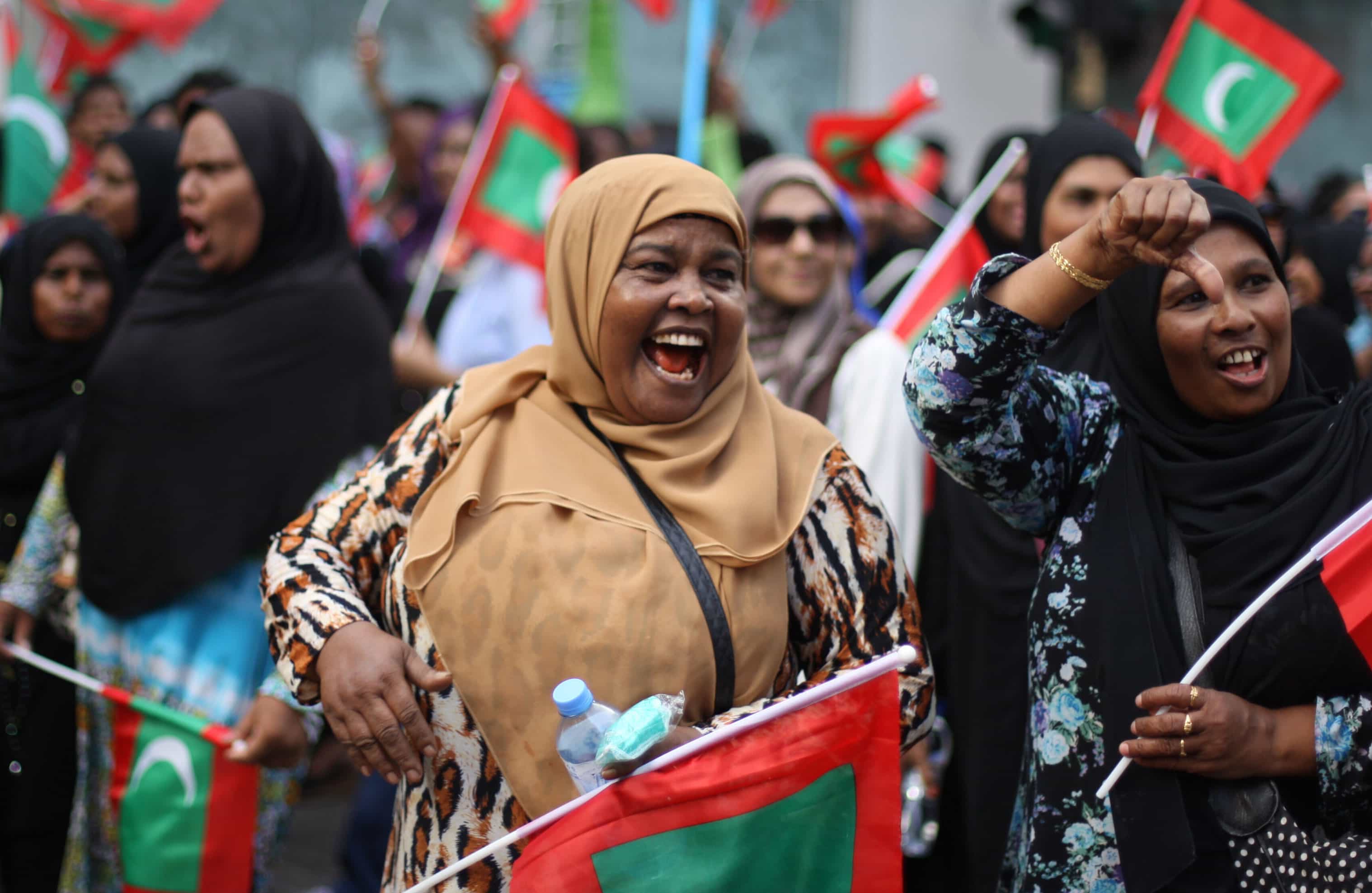 Opposition supporters take part in a protest demanding Maldives President Yameen Abdul Gayoom resign and jailed ex-president Mohamed Nasheed be freed, in Male', 1 May 2015, AP Photo/Sinan Hussain