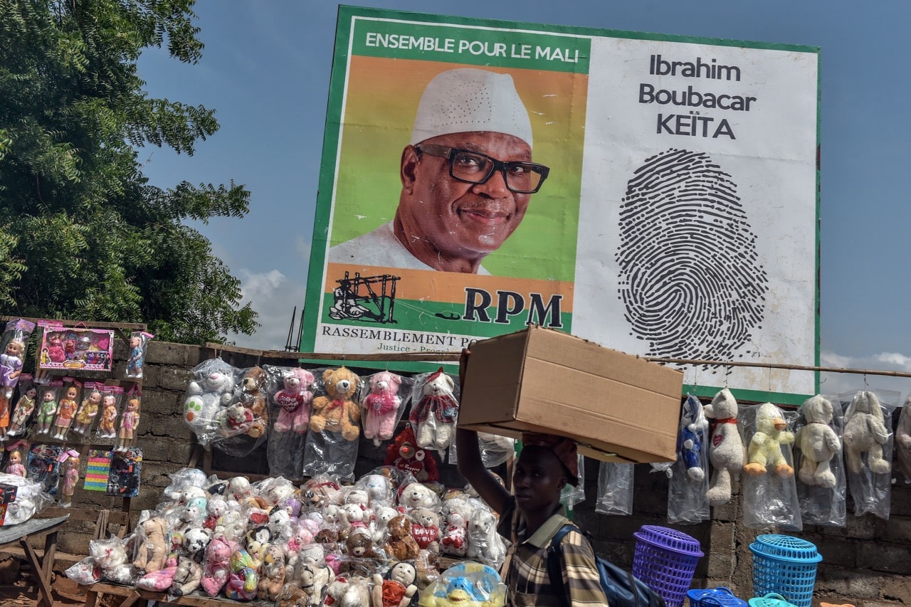 An electoral poster of Mali's incumbent president Ibrahim Boubacar Keita is displayed in a street of Bamako, 3 August 2018, ahead of the second round of the presidential election on 12 August, ISSOUF SANOGO/AFP/Getty Images