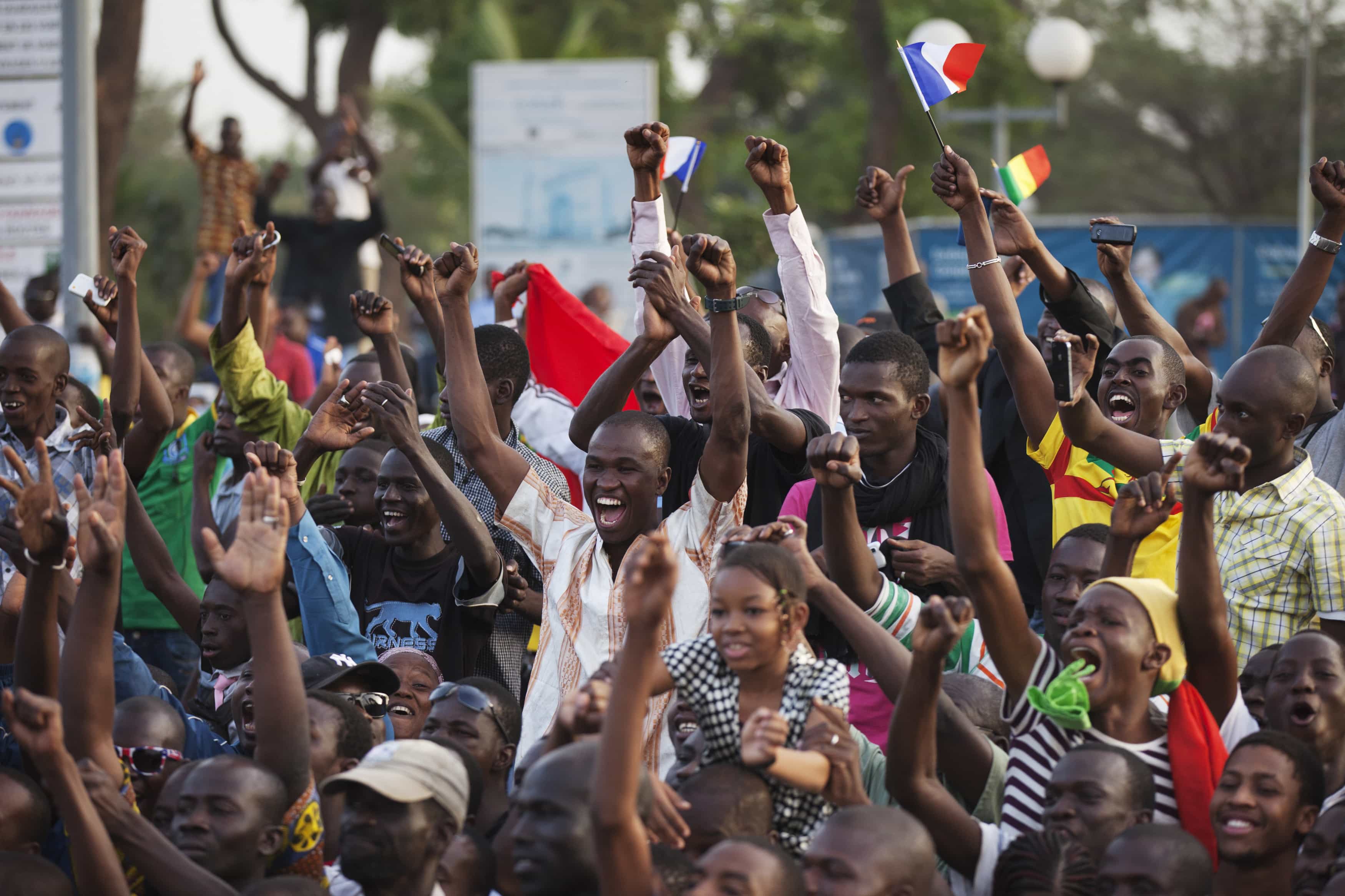 Malians cheer while France's President Francois Hollande speaks at Independence Plaza in Bamako, 2 February 2013, REUTERS/Joe Penney