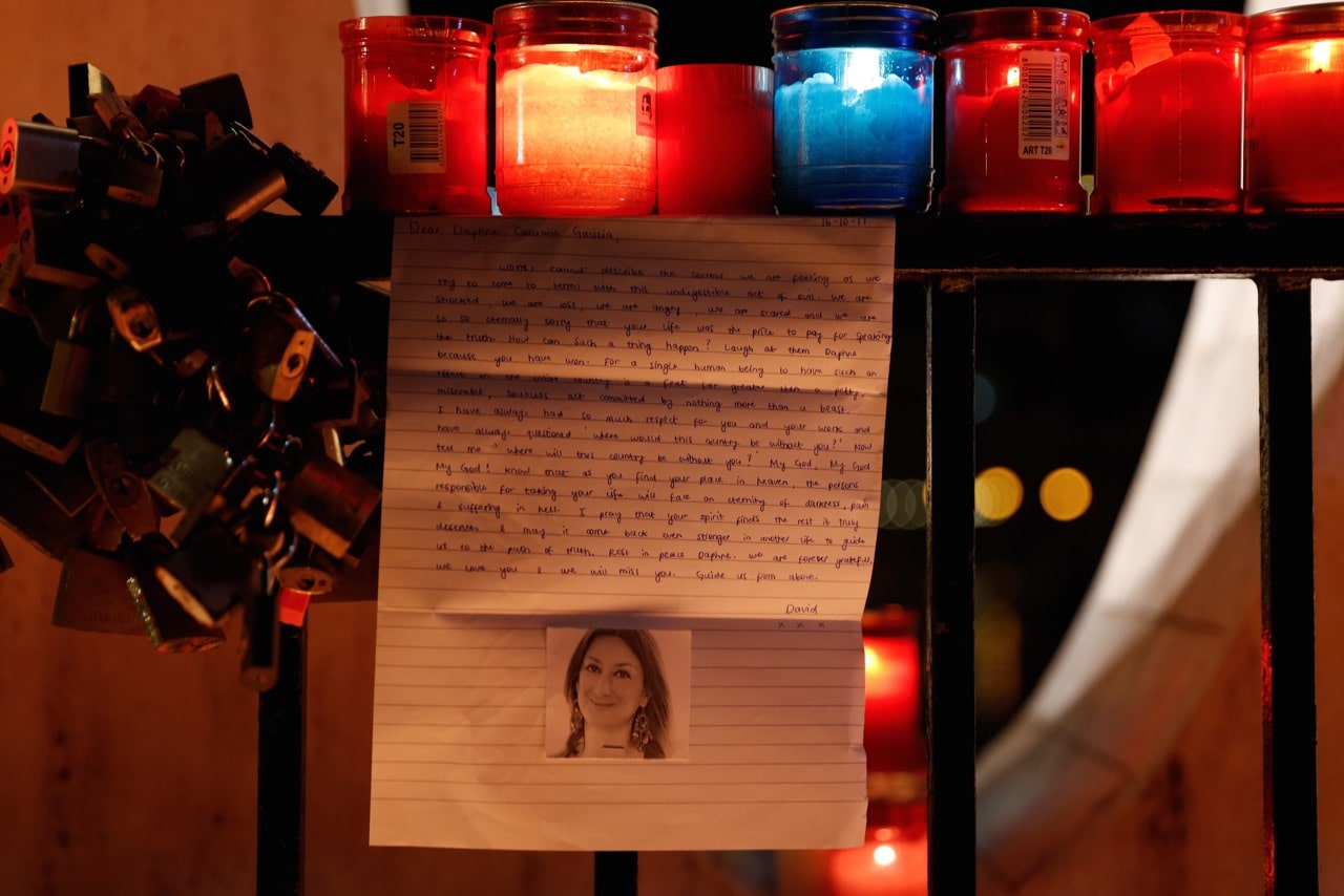 A letter to investigative journalist Daphne Caruana Galizia, assassinated in a car bomb attack, is seen during a silent candlelight vigil, in St Julian's, Malta, 16 October 2017, REUTERS/Darrin Zammit Lu