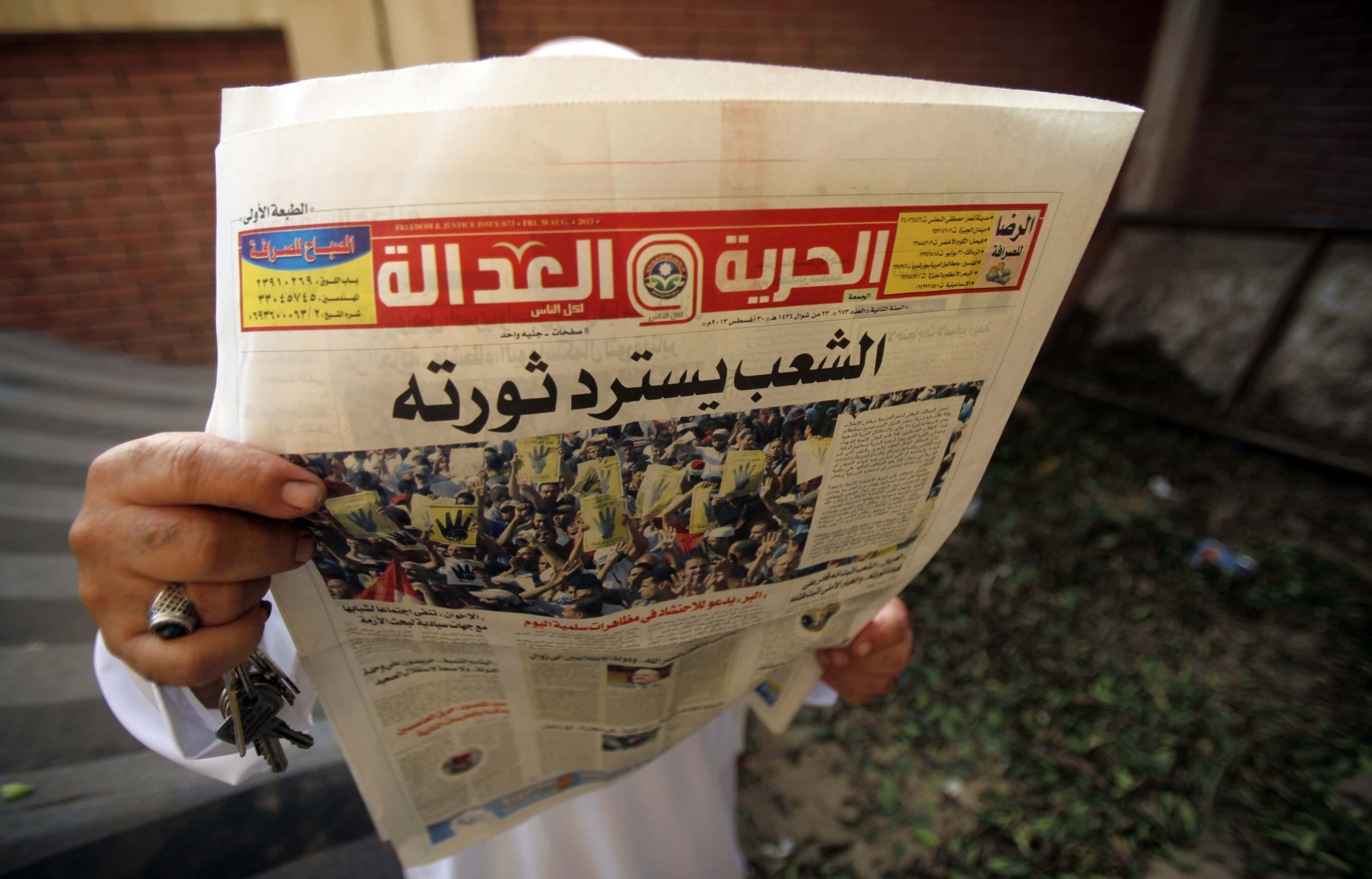 A man reads the Muslim Brotherhood's newspaper Al-Hurriya wa-l-adala (Freedom of Justice), named after their political party, in Cairo on 3 September 2013, REUTERS/Amr Abdallah Dalsh