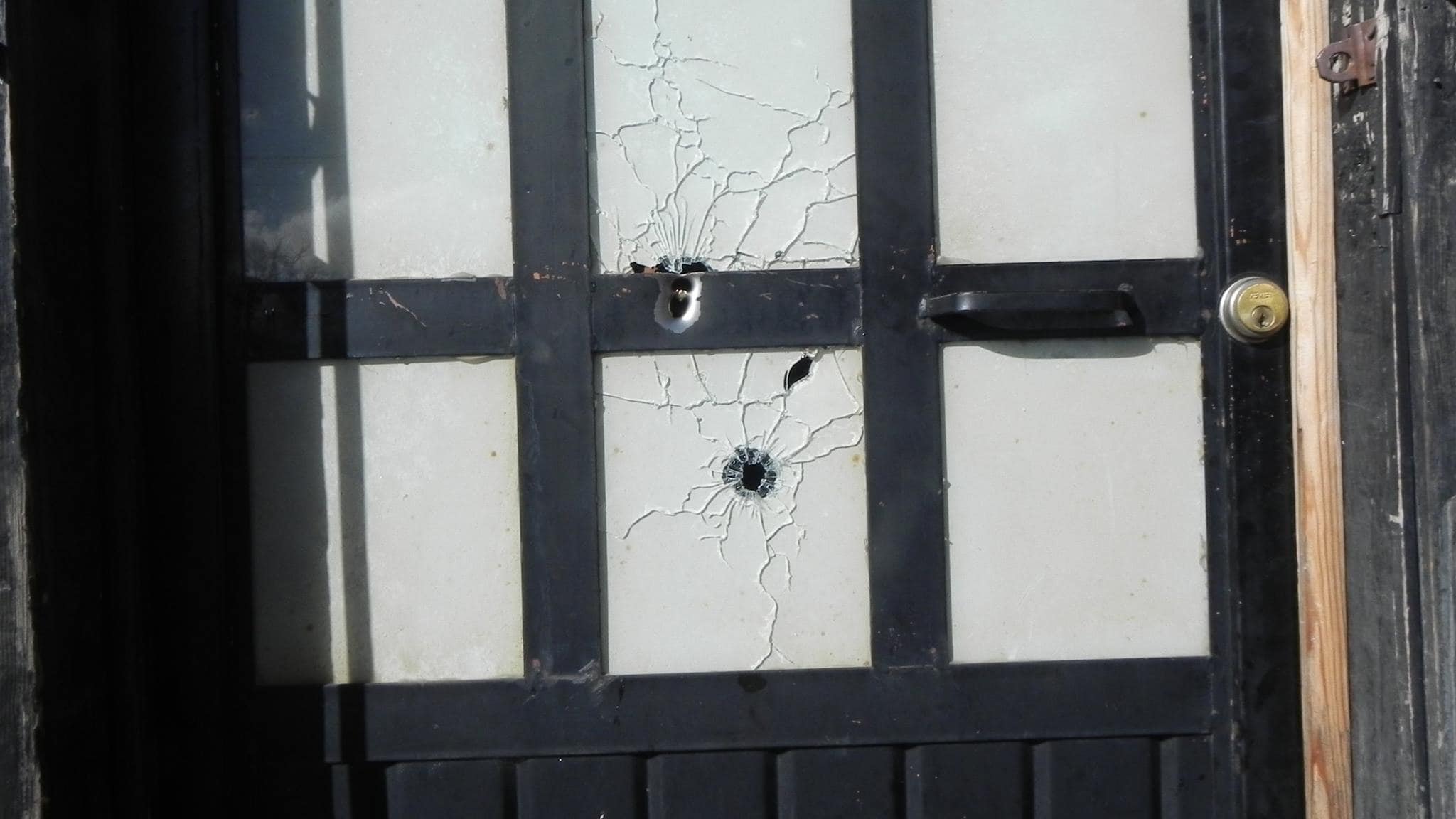 Bullet holes in the door to the home of journalist Gabriel Valencia Juárez, Norawa Facebook page