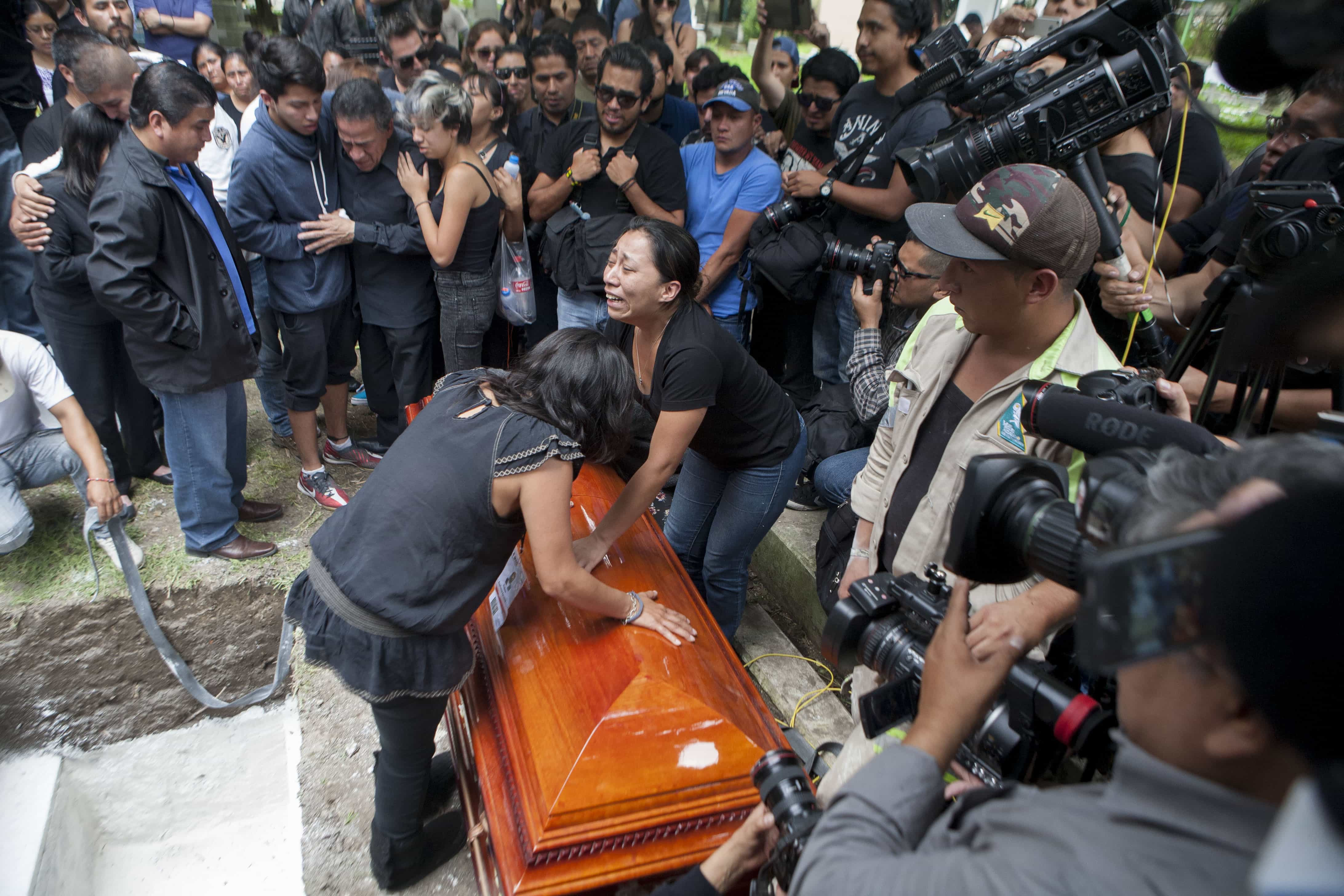 Family members of murdered photojournalist Ruben Espinosa grieve in Mexico City, 3 August 2015. Mexican journalist protection groups are expressing fears that authorities won't consider Espinosa's brutal killing as being related to his work - even though he fled the state he covered fearing for his safety., AP Photo/Sofia Jaramillo