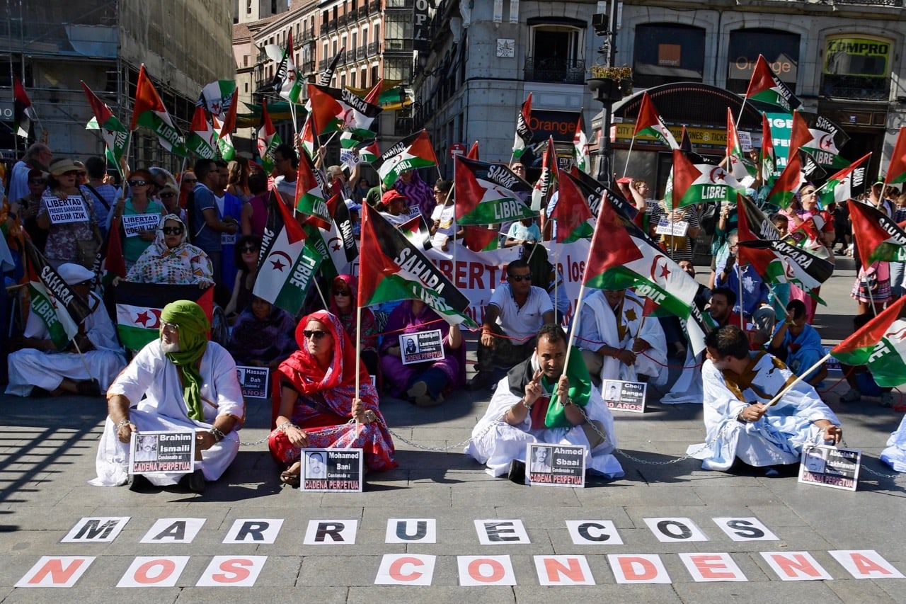 Protesters are chained together on the Puerta del Sol in Madrid, Spain on 27 July 2017, to denounce the prison sentences imposed by a Moroccan court on the political prisoners at the Saharawi camp of Gdeim Izik, JAVIER SORIANO/AFP/Getty Images