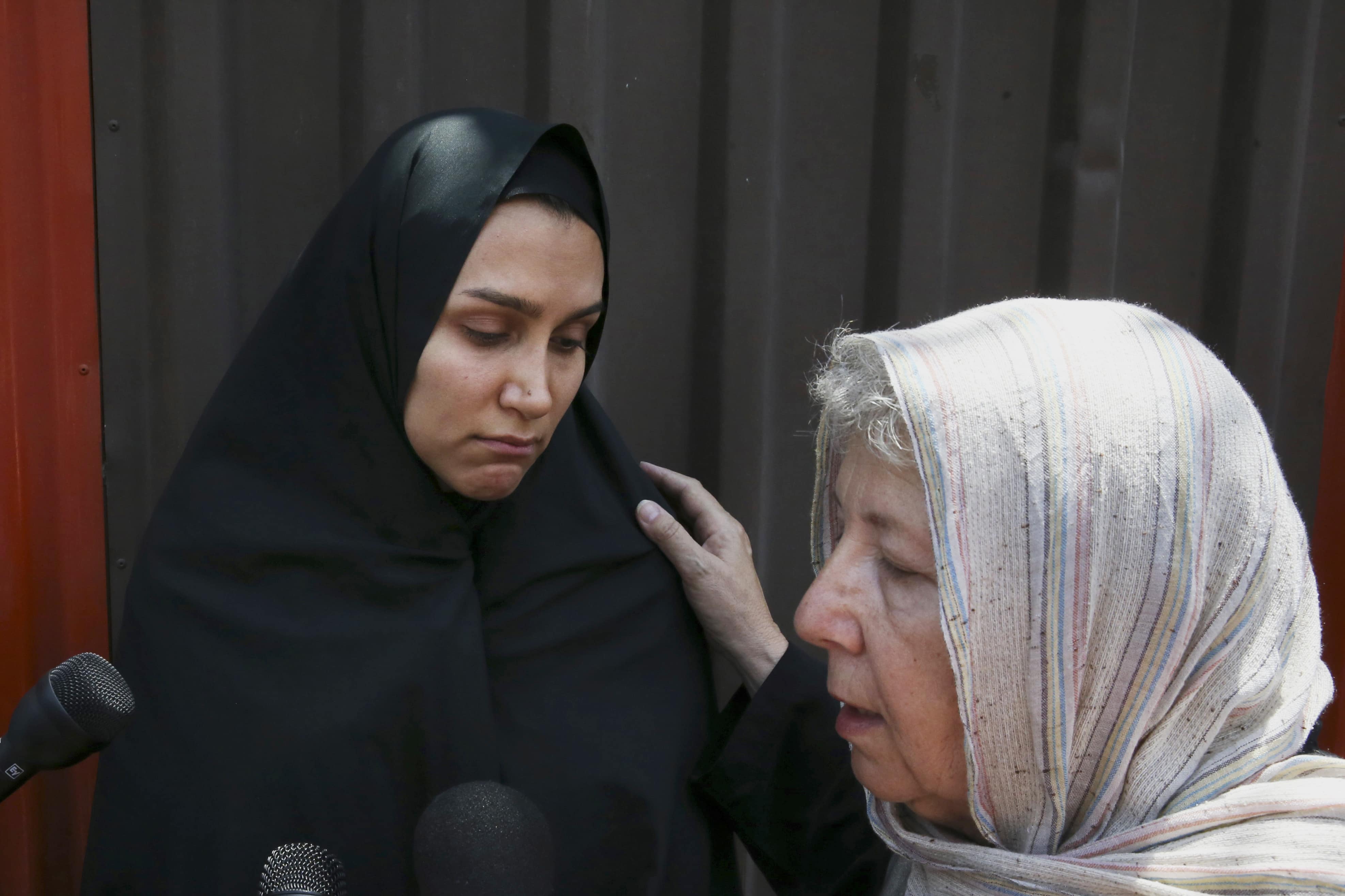 Jason Rezaian's mother, right, speaks with the media as his wife Yeganeh Salehi listens after a hearing in Jason's trial at the Revolutionary Court in Tehran, Iran on 13 July 2015, AP Photo/Vahid Salemi