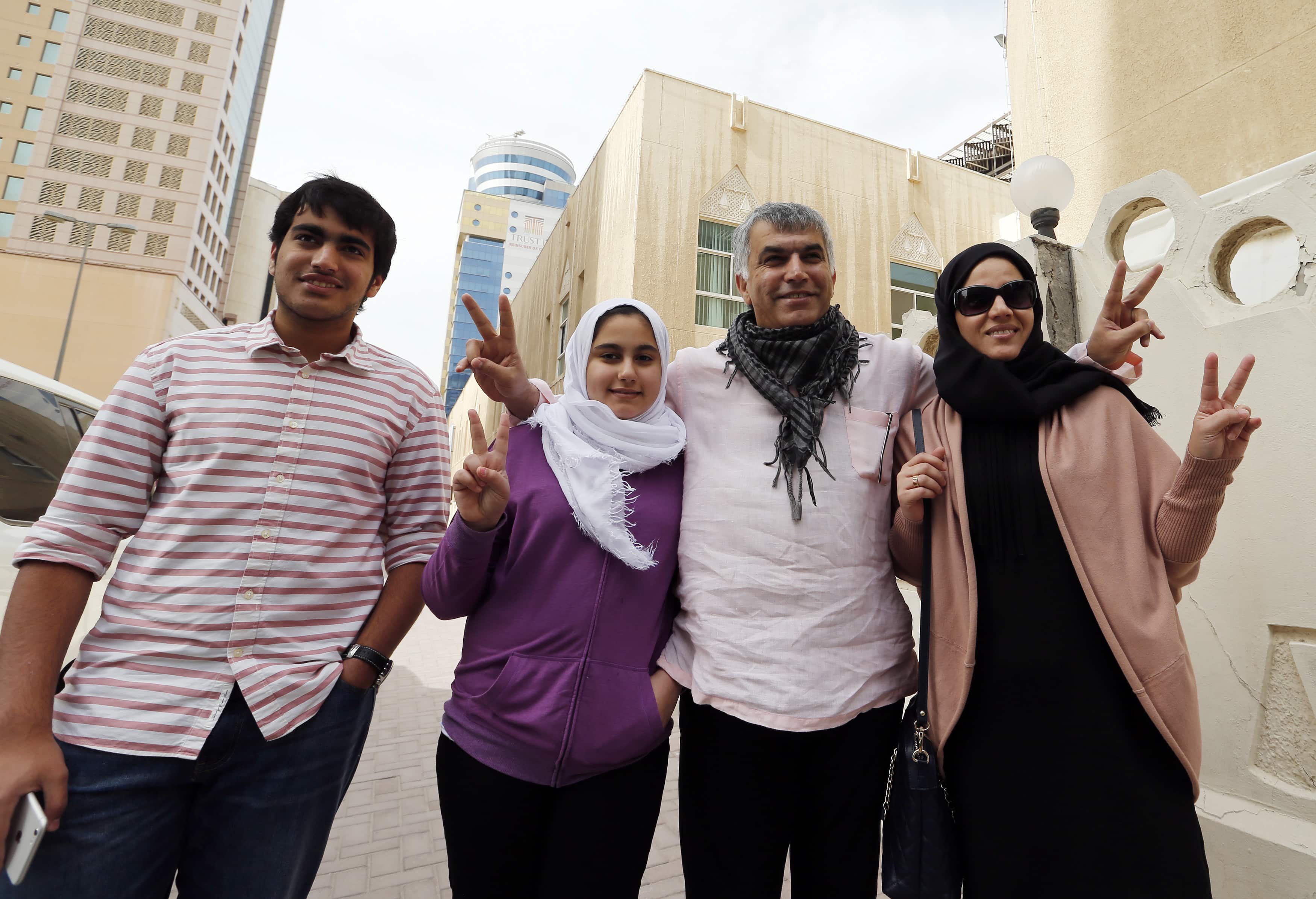 Human rights activist Nabeel Rajab (2nd R) poses with his wife Sumaiya (R), his daughter Malak (2nd L) and his son Adam as they arrive at court for his appeal hearing in Manama, February 11, 2015. He is now imprisoned on different charges. , REUTERS/Hamad Mohammed