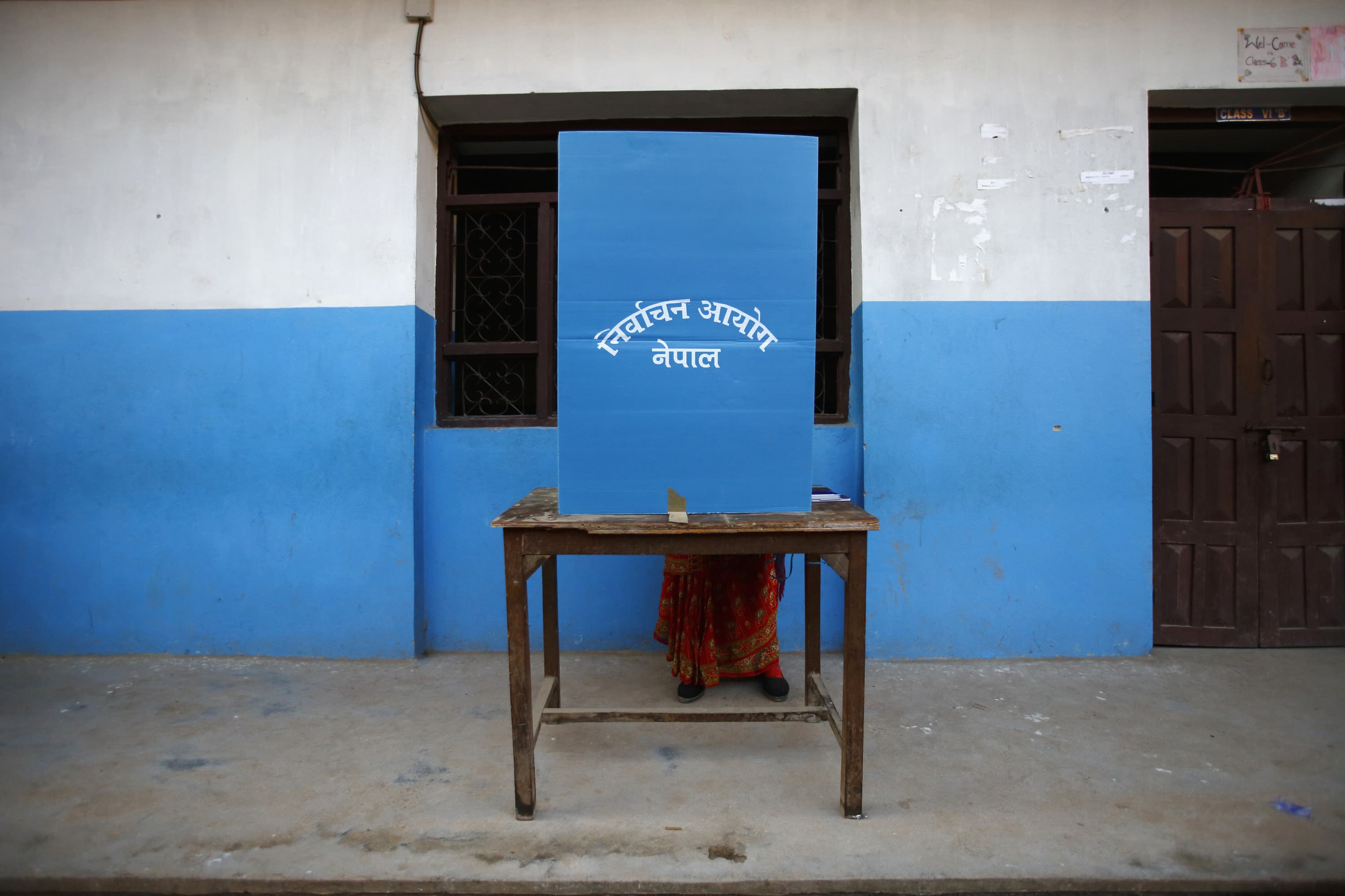 A Nepalese woman casts her vote during the Constituent Assembly Election in Bhaktapur, 19 November 2013, REUTERS/Navesh Chitrakar