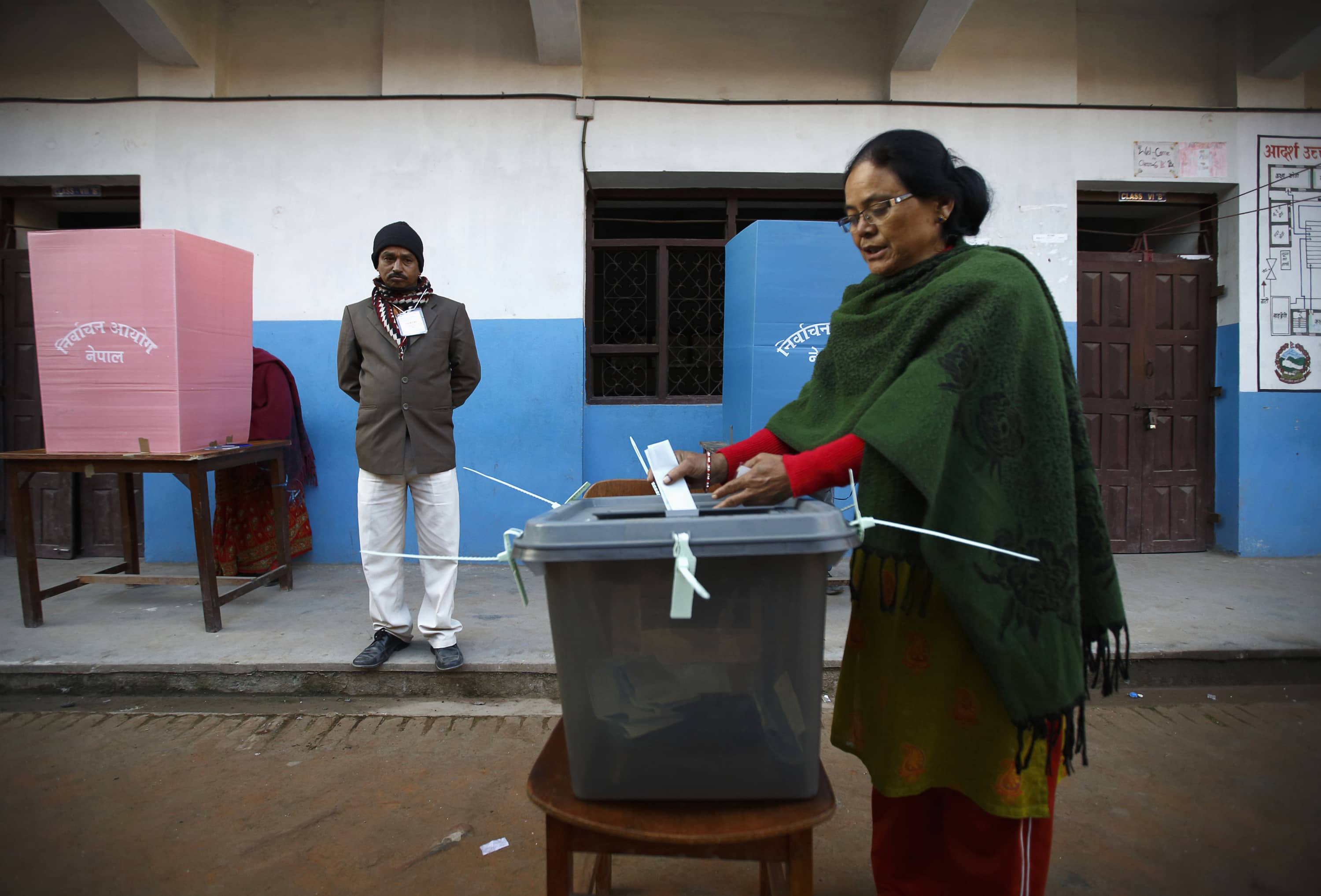 A Nepalese woman casts her vote during the Constituent Assembly Election in Bhaktapur, 19 November 2013, REUTERS/Navesh Chitrakar