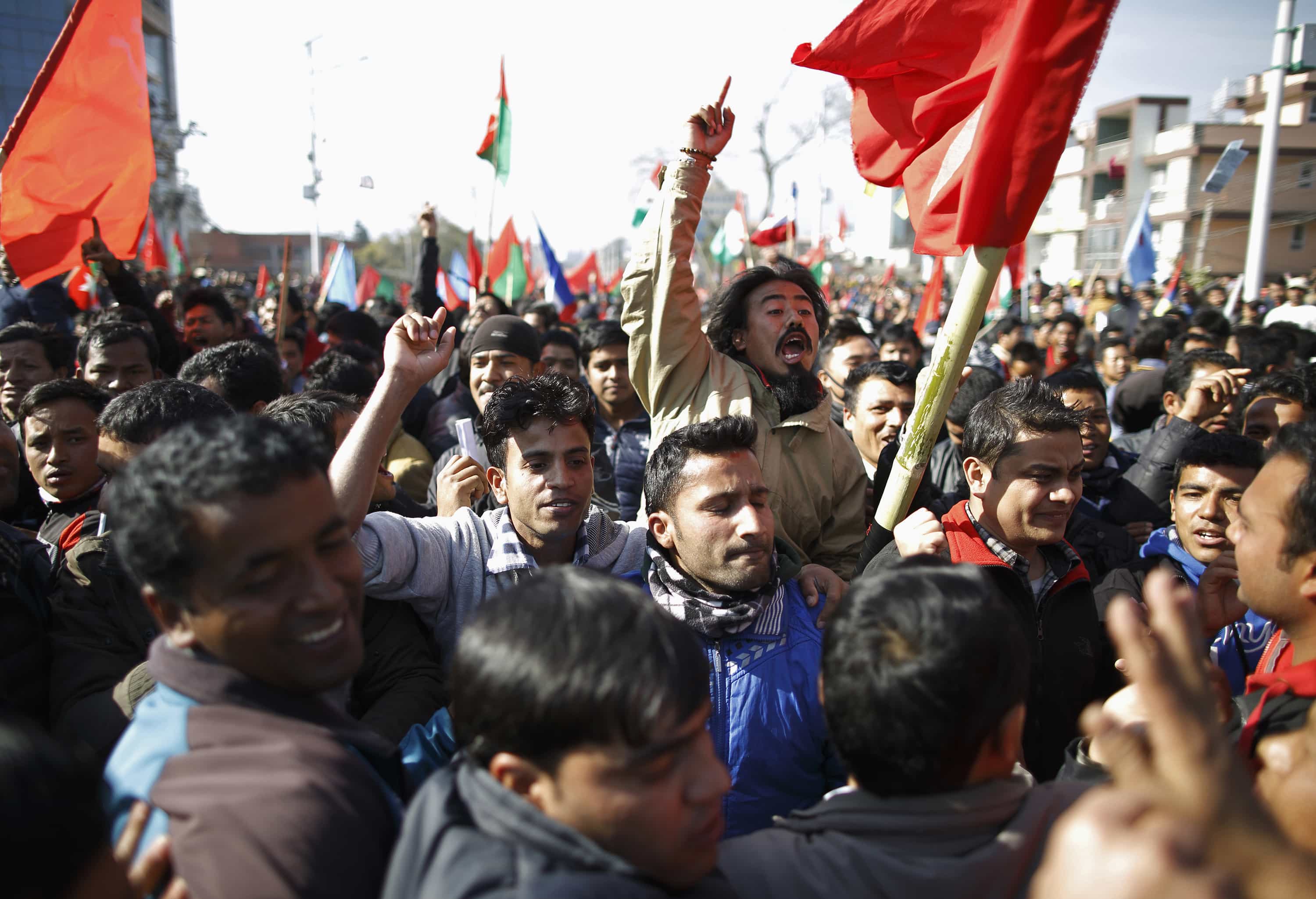 Protestors shout slogans as they try to break through the barricade during a general strike in Kathmandu, 20 January 2015, REUTERS/Navesh Chitrakar