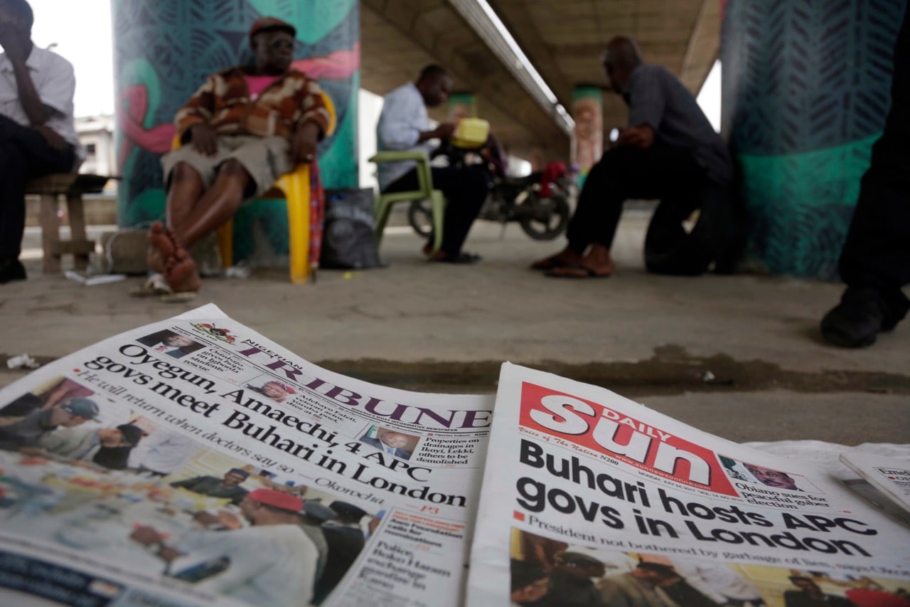 Newspapers are displayed on the streets of Lagos, including stories on Nigerian President Muhammadu Buhari meeting with ruling party governors, 24 July 2017, AP Photo/Sunday Alamba