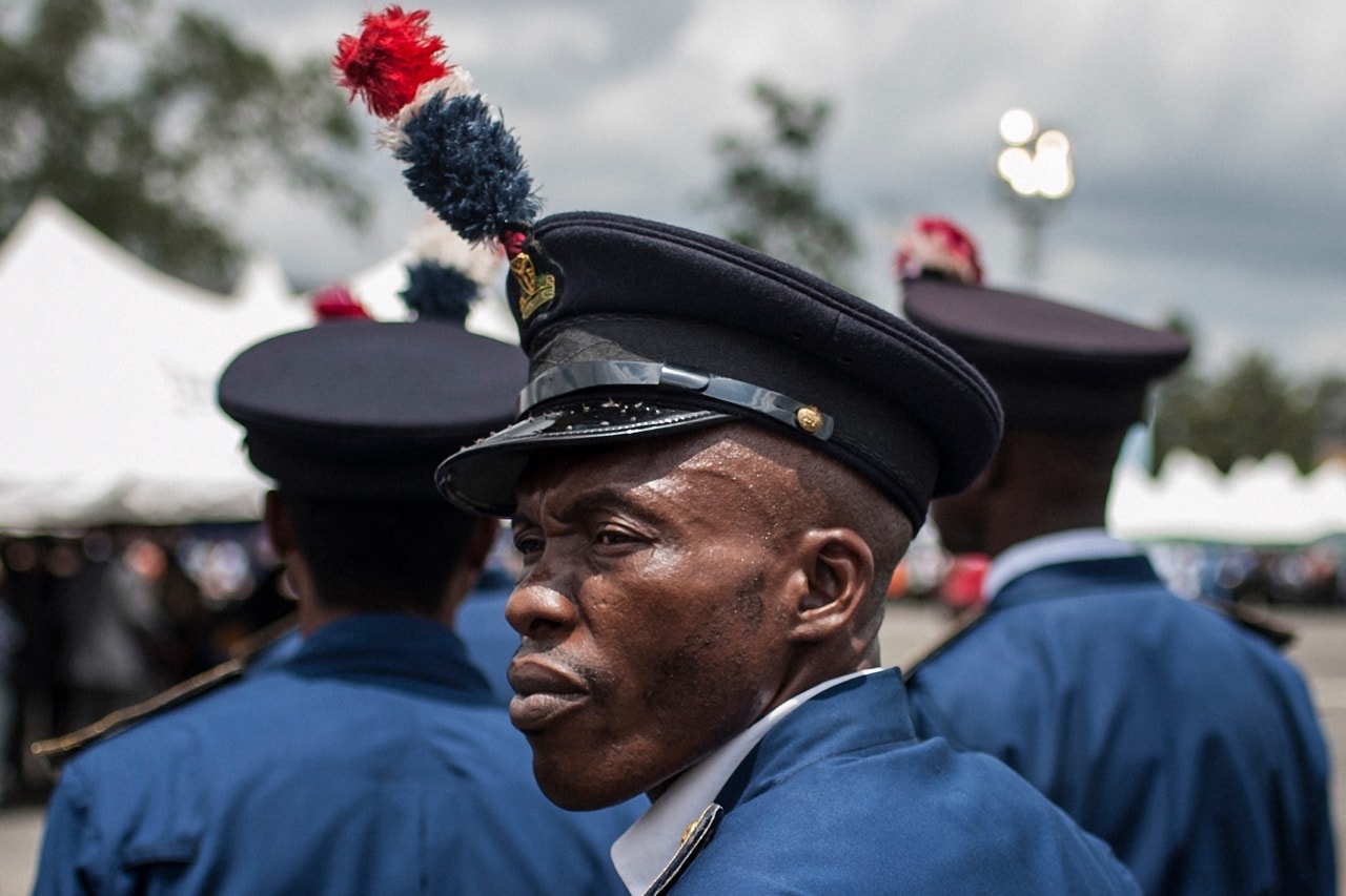 A member of the Nigerian Police Force, wearing ceremonial dress, looks on during a Democracy Day parade in Freedom Square in Owerri, 29 May 2017, STEFAN HEUNIS/AFP/Getty Images