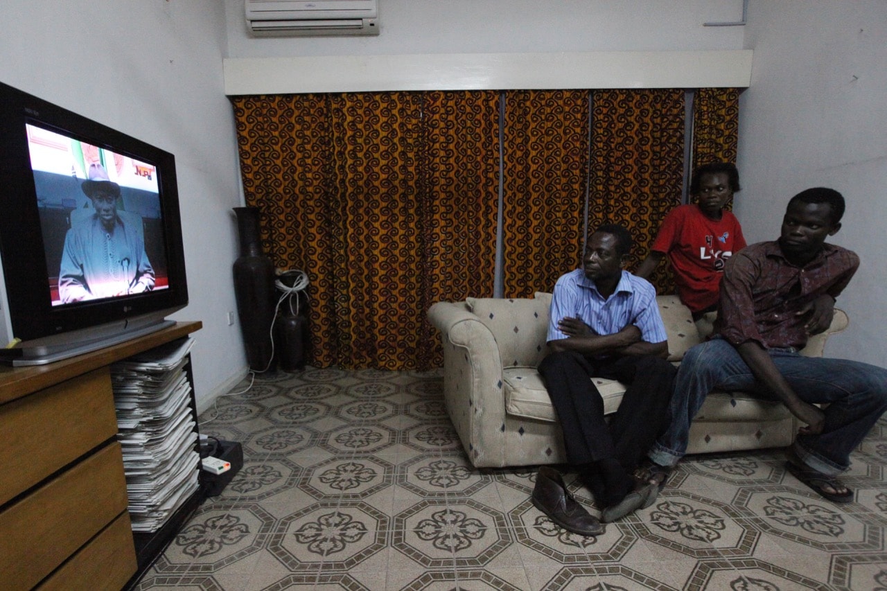 Residents watch TV in Lagos, Nigeria as then Vice President Goodluck Jonathan addresses the nation, 9 February 2010, AP Photo/Sunday Alamba