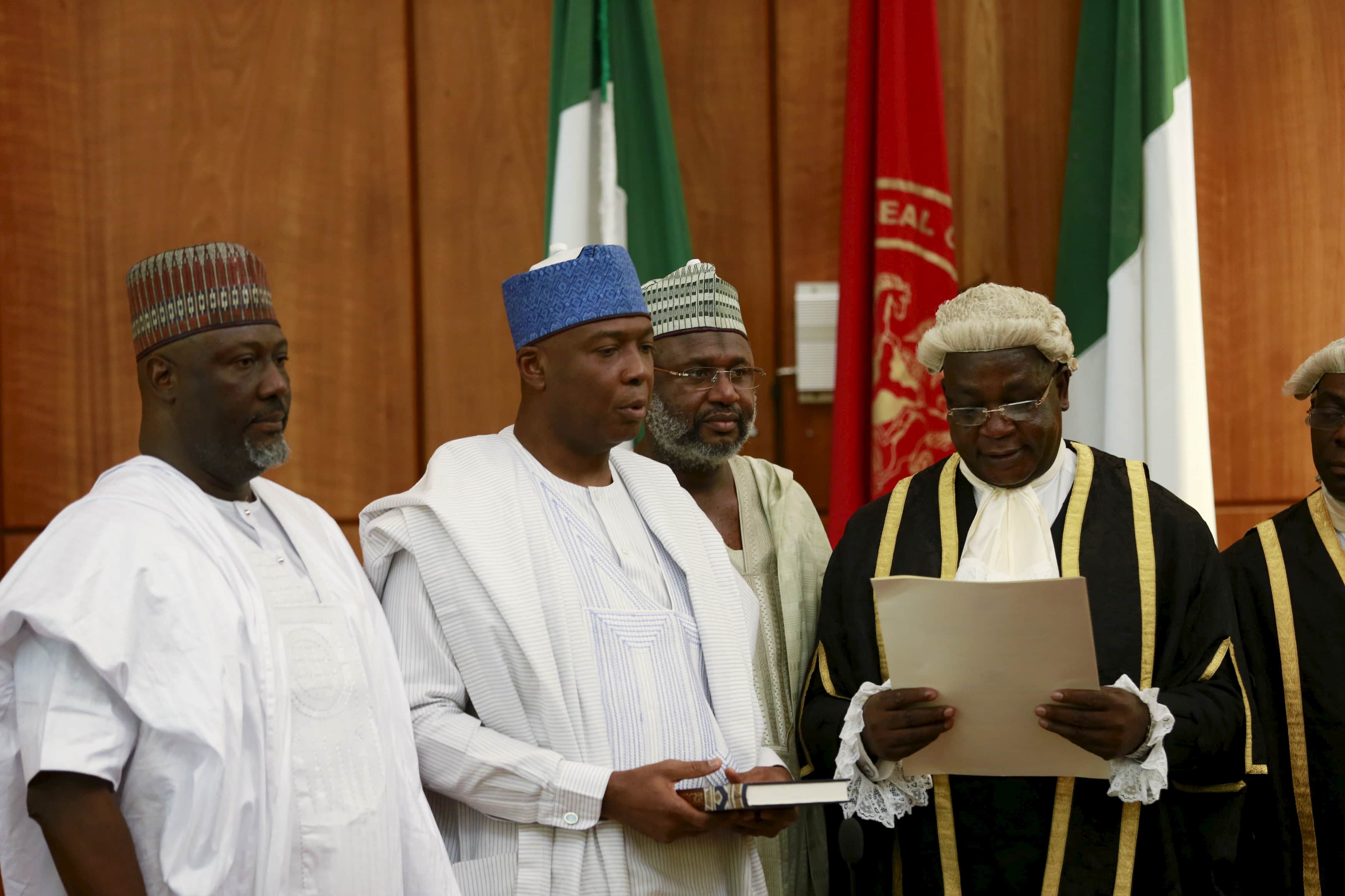 Bukola Saraki (2nd L) takes the oath of office as the senate president of the 8th Nigeria Assembly in Abuja, Nigeria, 9 June 2015, REUTERS/Afolabi Sotunde