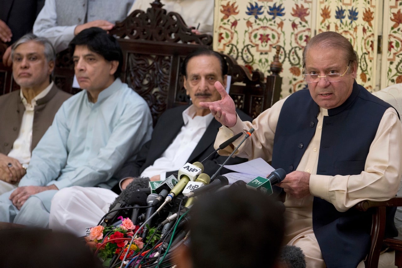 Pakistan's former Prime Minister Nawaz Sharif, right, addresses a news conference with party fellows after his first appearance before an anti-corruption court in Islamabad, 26 September 2017, AP Photo/B.K. Bangash