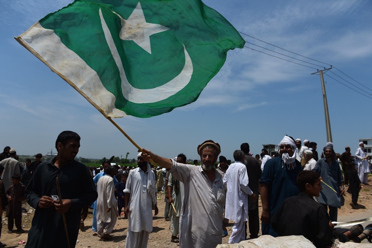 Pakistani and Afghan Pashtun people gather at a rally to defend their housing at a slum area of Islamabad, Pakistan, 27 July 2015, FAROOQ NAEEM/AFP/Getty Images