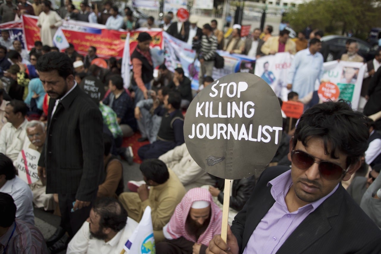 In this 20 March 2014 file picture, Pakistani journalists hold a sit-in protest before the Parliament in Islamabad demanding protection, AP Photo/B.K. Bangash, File