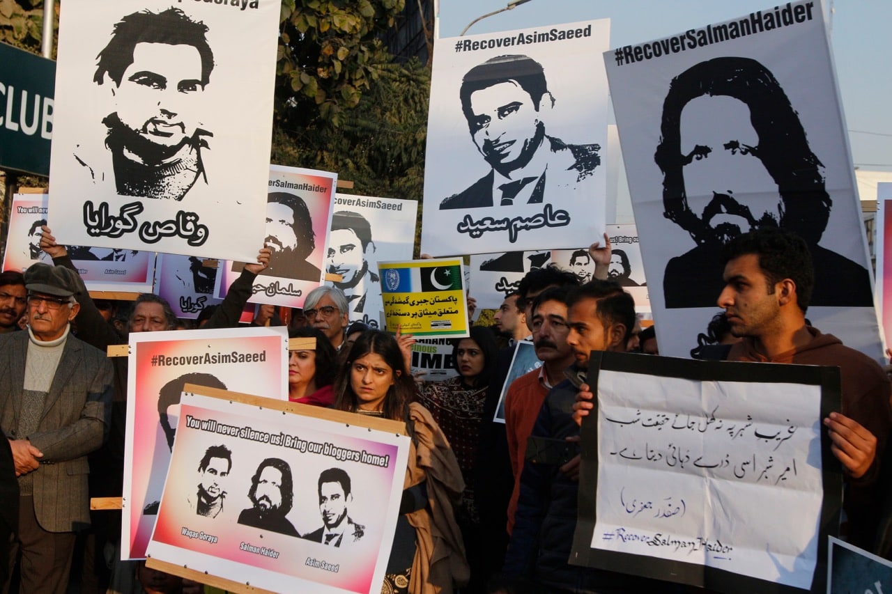 During a protest in Lahore, Pakistani members of civil society hold images of bloggers who have disappeared, 12 January 2017, Rana Sajid Hussain/Pacific Press/LightRocket via Getty Images