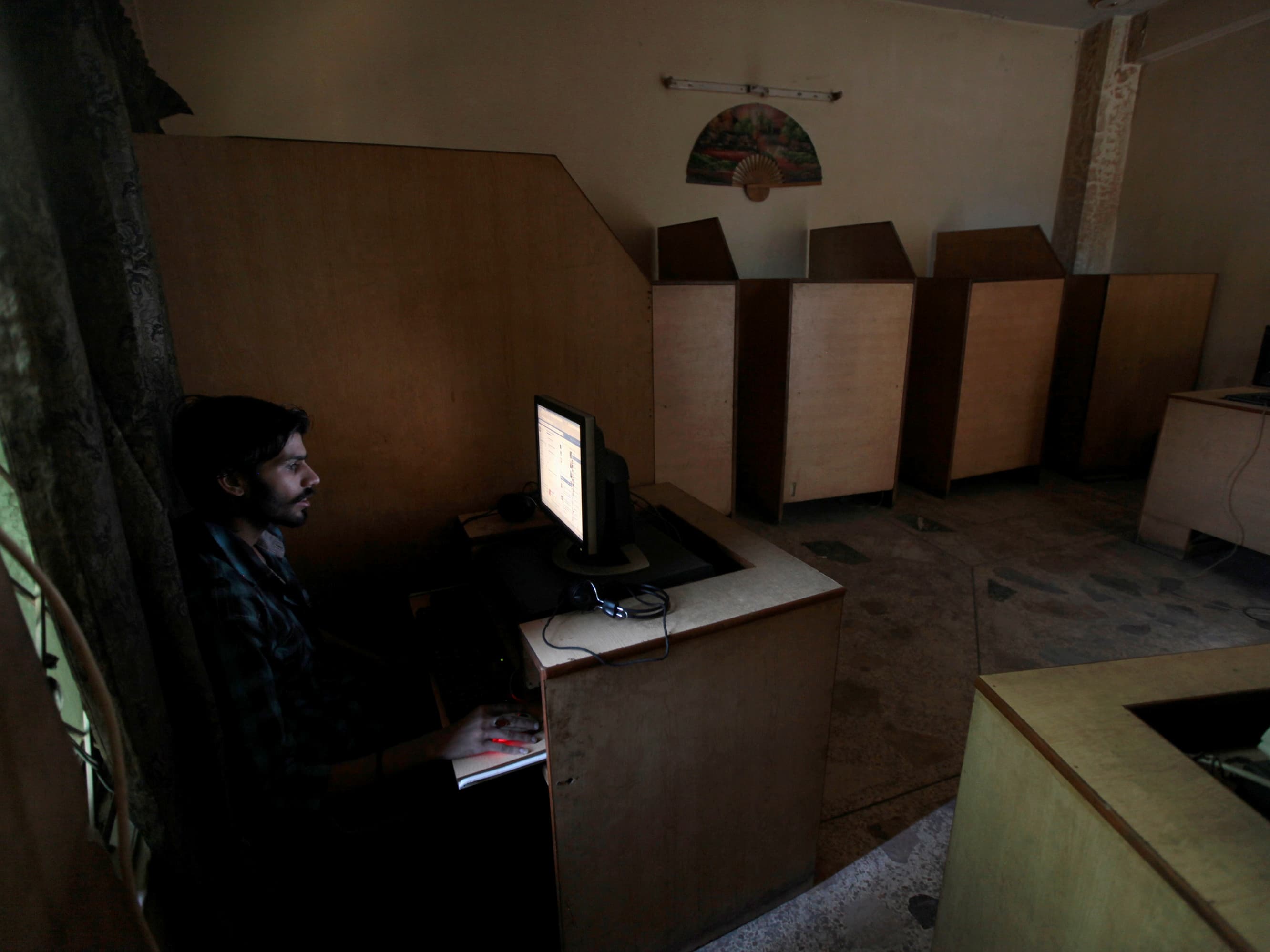 A man at an Internet cafe in Rawalpindi, Pakistan, 18 September 2013, REUTERS/Faisal Mahmood
