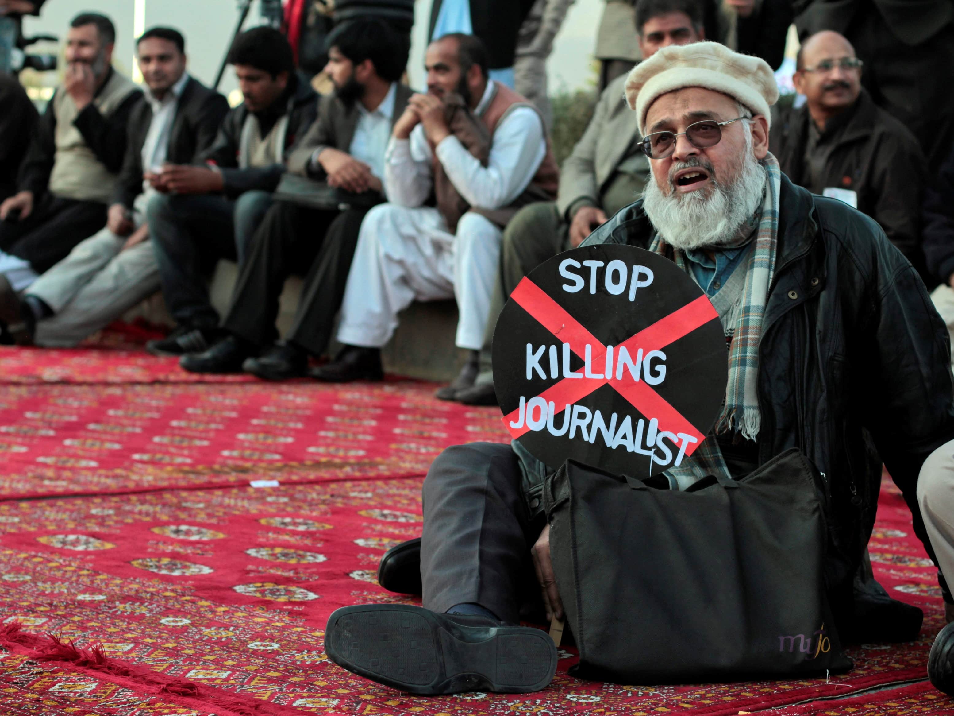 A journalist takes part in a protest in front of the Parliament building in Islamabad, January 2013; reporters from all over the country demonstrated against a spate of killings of their colleaguess and demanded compensation for the deceased, REUTERS/Faisal Mahmood