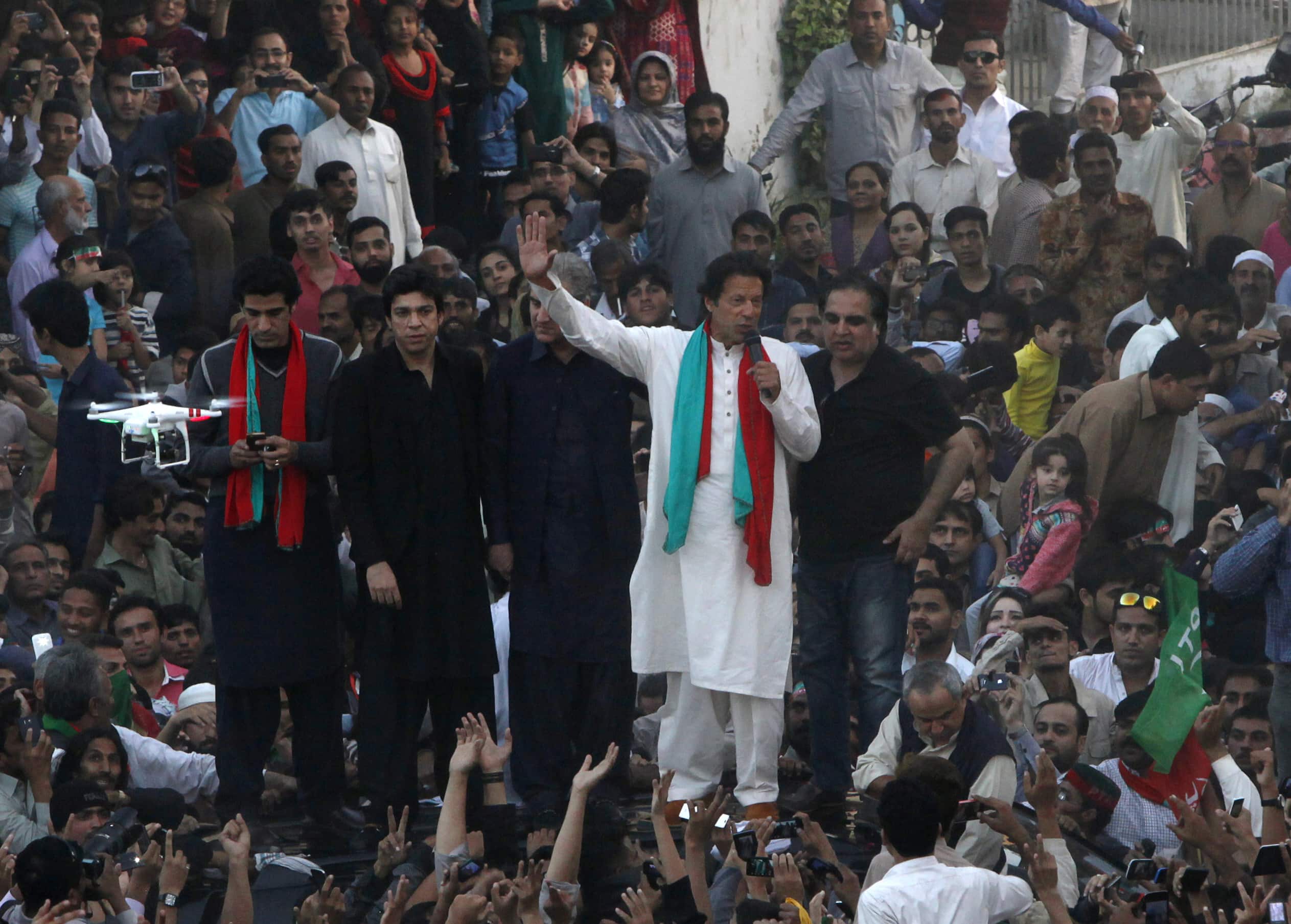 Imran Khan, cricketer-turned-politician and chairman of the Pakistan Tehreek-e-Insaf (PTI) political party, gestures while speaking to his supporters during an anti-government rally in Karachi, 12 December 2014, REUTERS/Akhtar Soomro