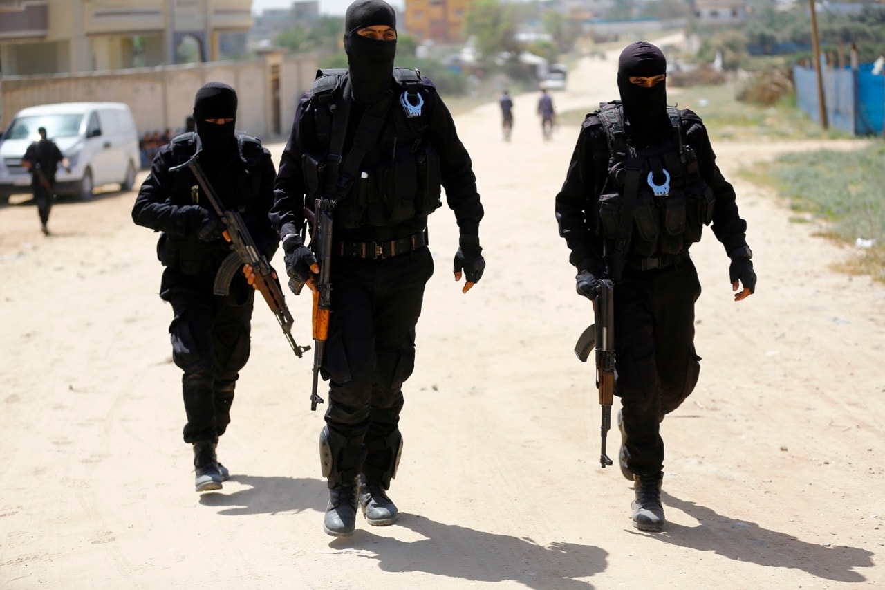 Hamas policemen carry out a raid in Nuseirat, south of Gaza City, 22 March 2018, MOHAMMED ABED/AFP/Getty Images