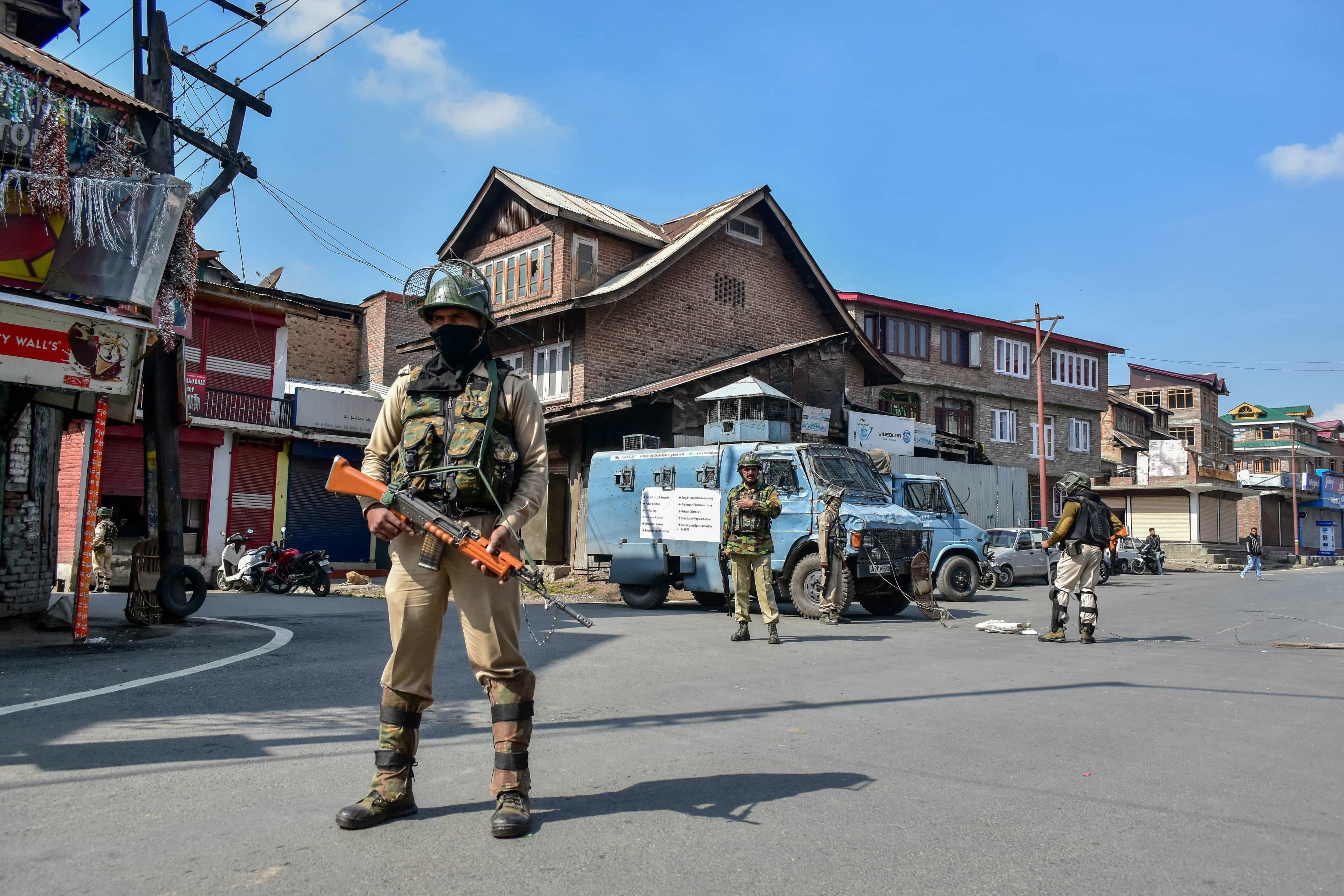 Indian paramilitary troopers stand guard during restrictions in Srinagar, Indian administered Kashmir, 11 October 2018, Saqib Majeed/SOPA Images/LightRocket via Getty Images