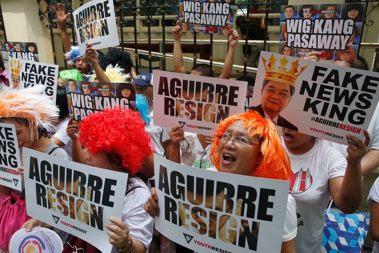 Protesters demand the resignation of Justice Secretary Vitaliano Aguirre II outside the Justice Department, in Manila, Philippines, 20 September 2017. Aguirre was accused of spreading fake news against the opposition, AP Photo/Bullit Marquez