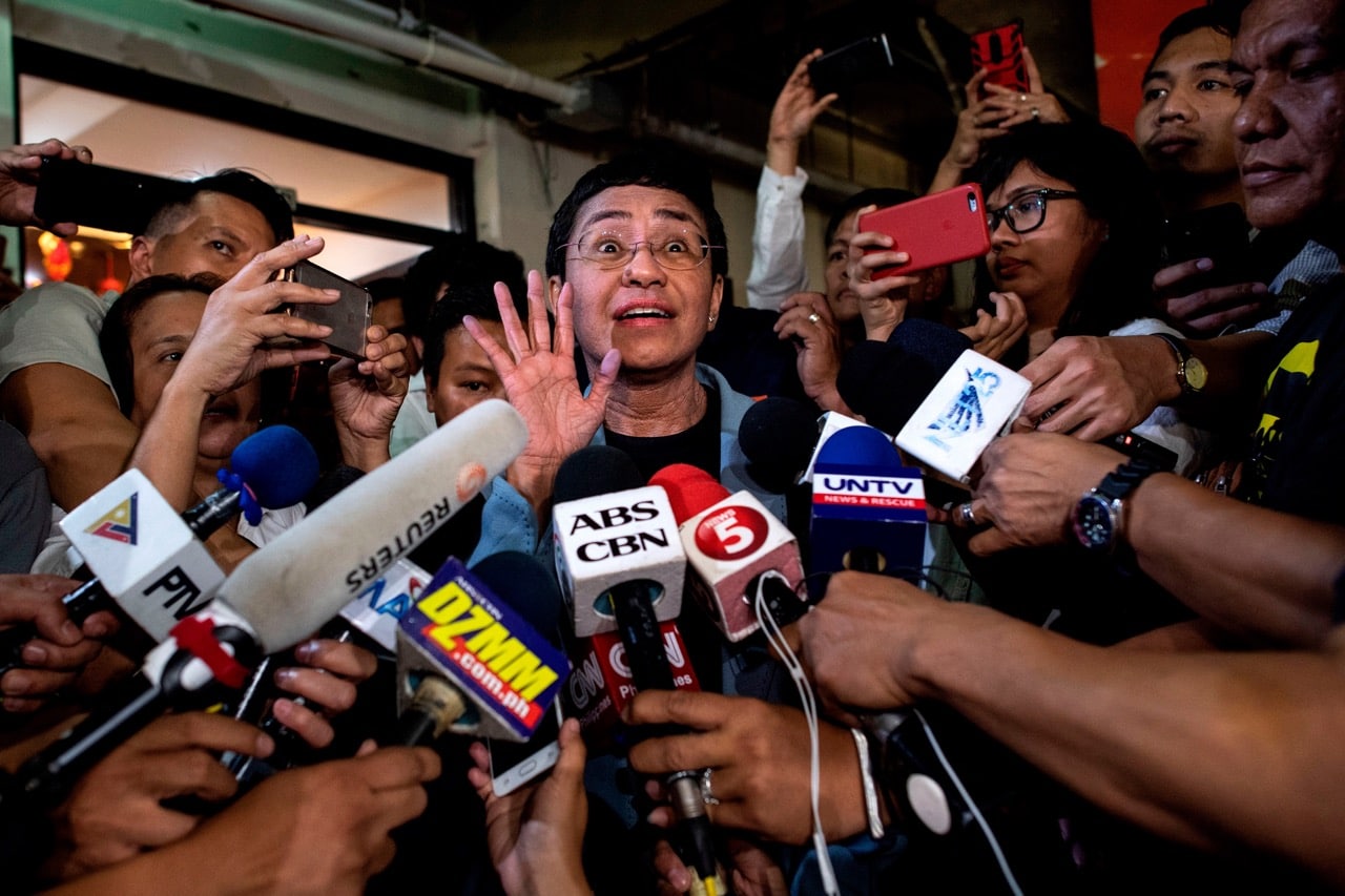 Philippine journalist Maria Ressa (C) gives a statement after posting bail at a regional trial court in Manila, 14 February 2019, NOEL CELIS/AFP/Getty Images