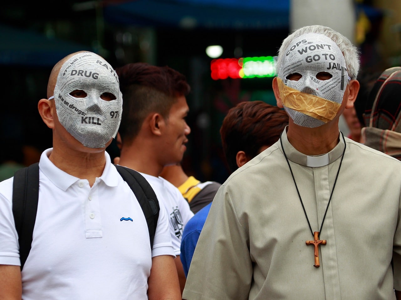 Manila Auxiliary Bishop Broderick Pabillo, right, and Fr. Robert Reyes join a protest against alleged extra judicial killings in Manila, 14 December 2016, AP Photo/Aaron Favila