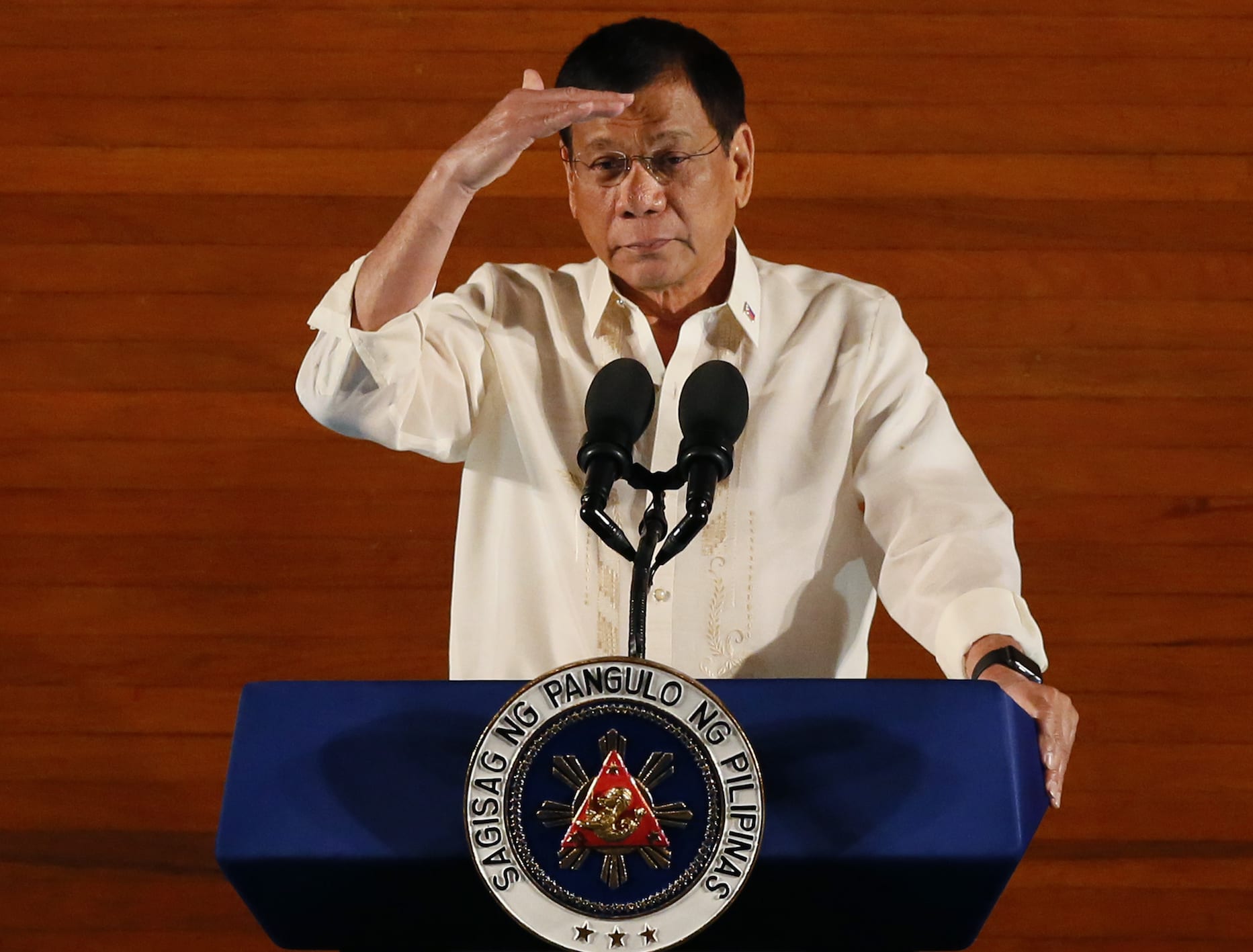 Philippine President Rodrigo Duterte gestures as he delivers his first State of the Nation Address (SONA) before the joint session of the 17th Congress, 25 July 2016, AP Photo/Bullit Marquez